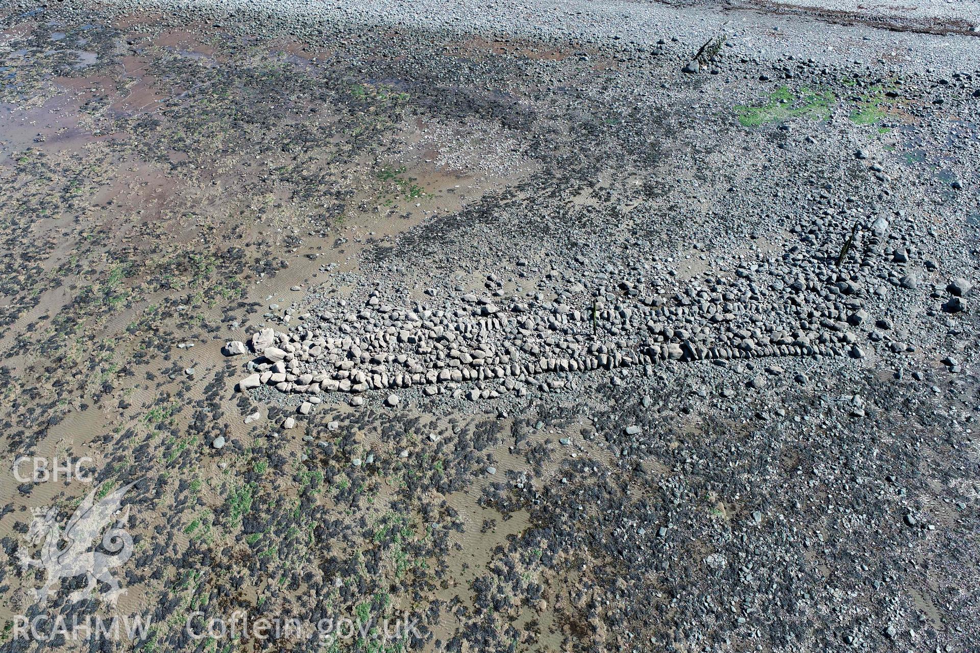 Breakwater, Aberstrincell from the northwest. Part of photographic survey of Aberstrincell lime kilns and coal yard, conducted by Louise Barker of the RCAHMW survey team on 21 March 2024.