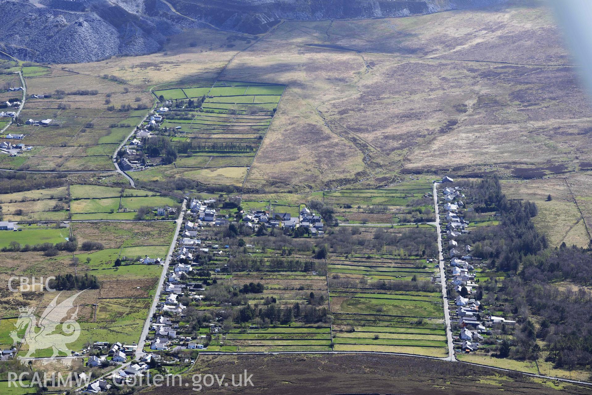 Mynydd Llandygai, terraced housing, view from north-west. Oblique aerial photograph taken during the Royal Commission’s programme of archaeological aerial reconnaissance by Toby Driver on 20 April 2018. (edited)