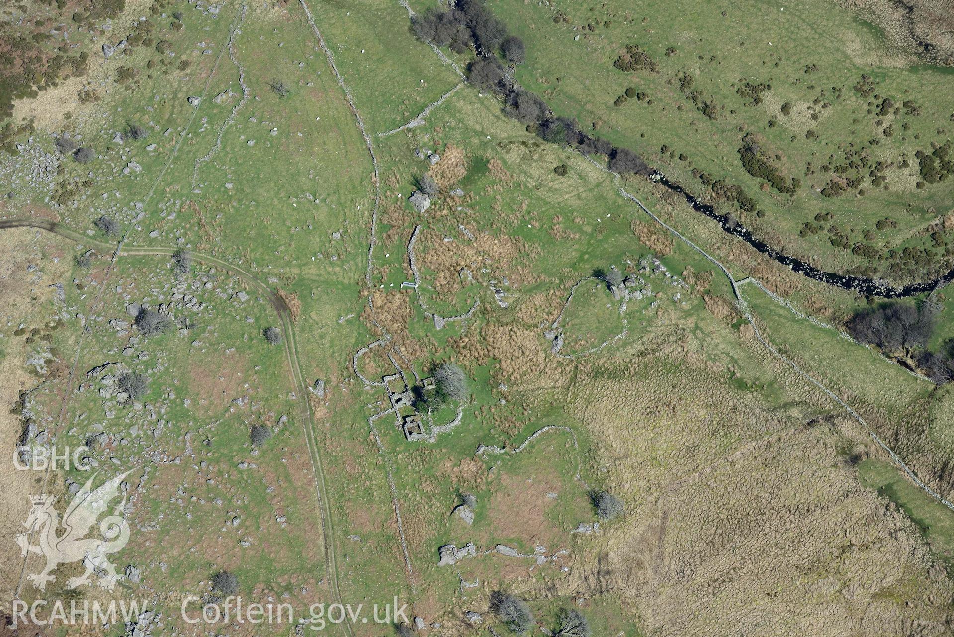 Maen Eira, Farmhouse and enclosures. Oblique aerial photograph taken during the Royal Commission’s programme of archaeological aerial reconnaissance by Toby Driver on 20 April 2018.