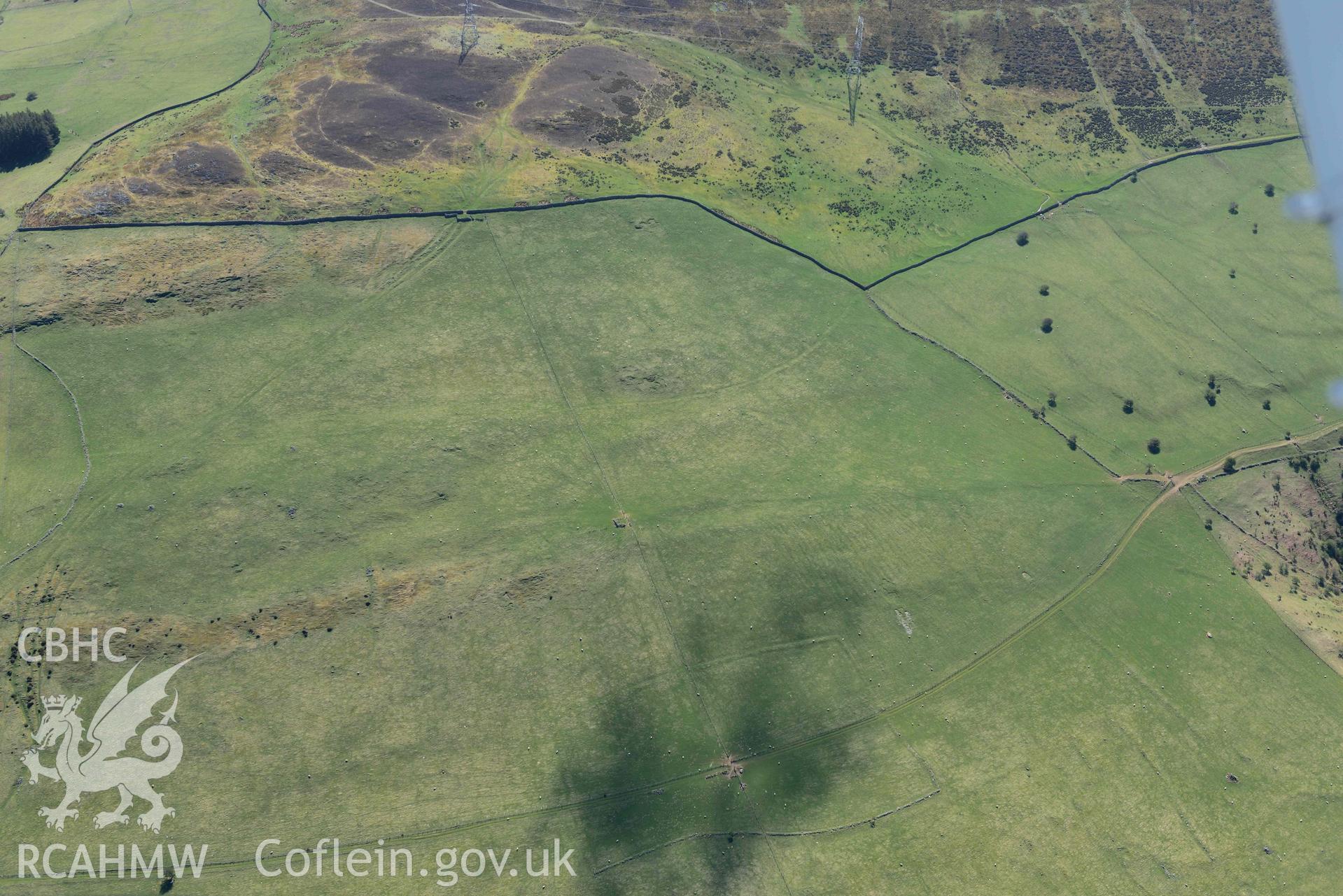 Ffridd Ddu, hut circle settlement, view from north-west. Oblique aerial photograph taken during the Royal Commission’s programme of archaeological aerial reconnaissance by Toby Driver on 20 April 2018.