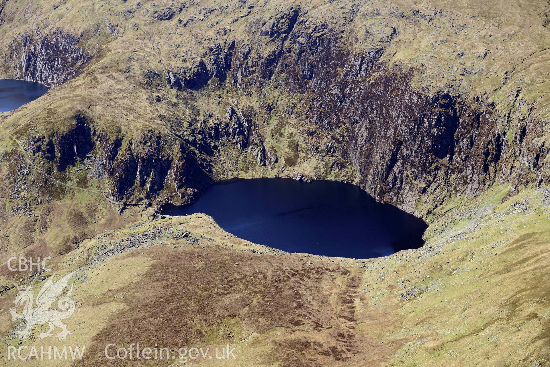 Llyn Dulyn Reservoir, and Melynllyn, mountain landscape from North East. Oblique aerial photograph taken during the Royal Commission’s programme of archaeological aerial reconnaissance by Toby Driver on 20 April 2018.