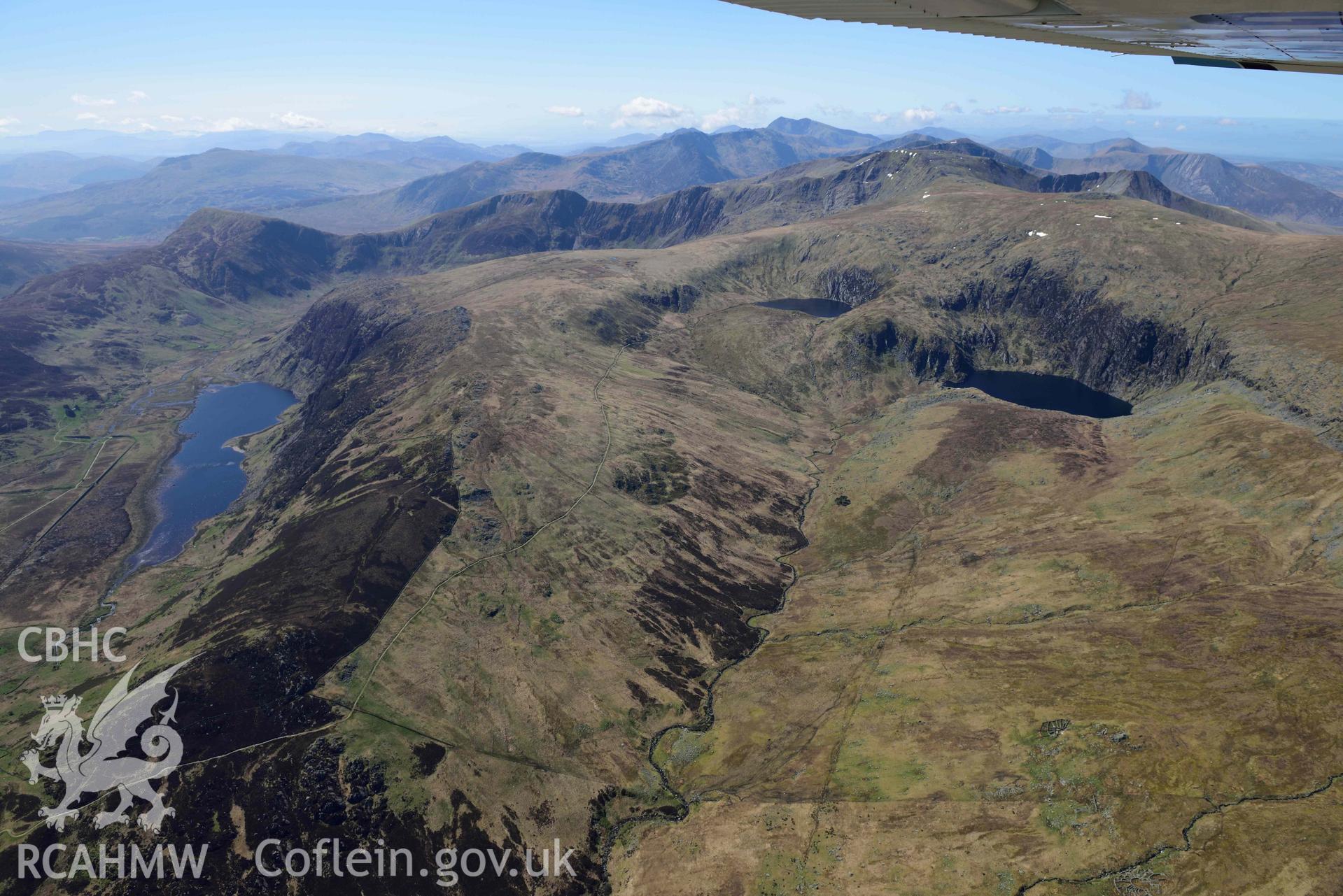 Llyn Dulyn Reservoir, with Melynllyn and Llyn Eigiau, mountain landscape from north-east. Oblique aerial photograph taken during the Royal Commission’s programme of archaeological aerial reconnaissance by Toby Driver on 20 April 2018.