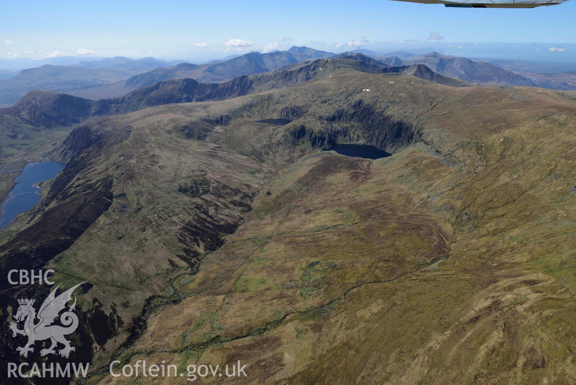 Llyn Dulyn Reservoir, with Melynllyn and Llyn Eigiau, mountain landscape from north-east. Oblique aerial photograph taken during the Royal Commission’s programme of archaeological aerial reconnaissance by Toby Driver on 20 April 2018.