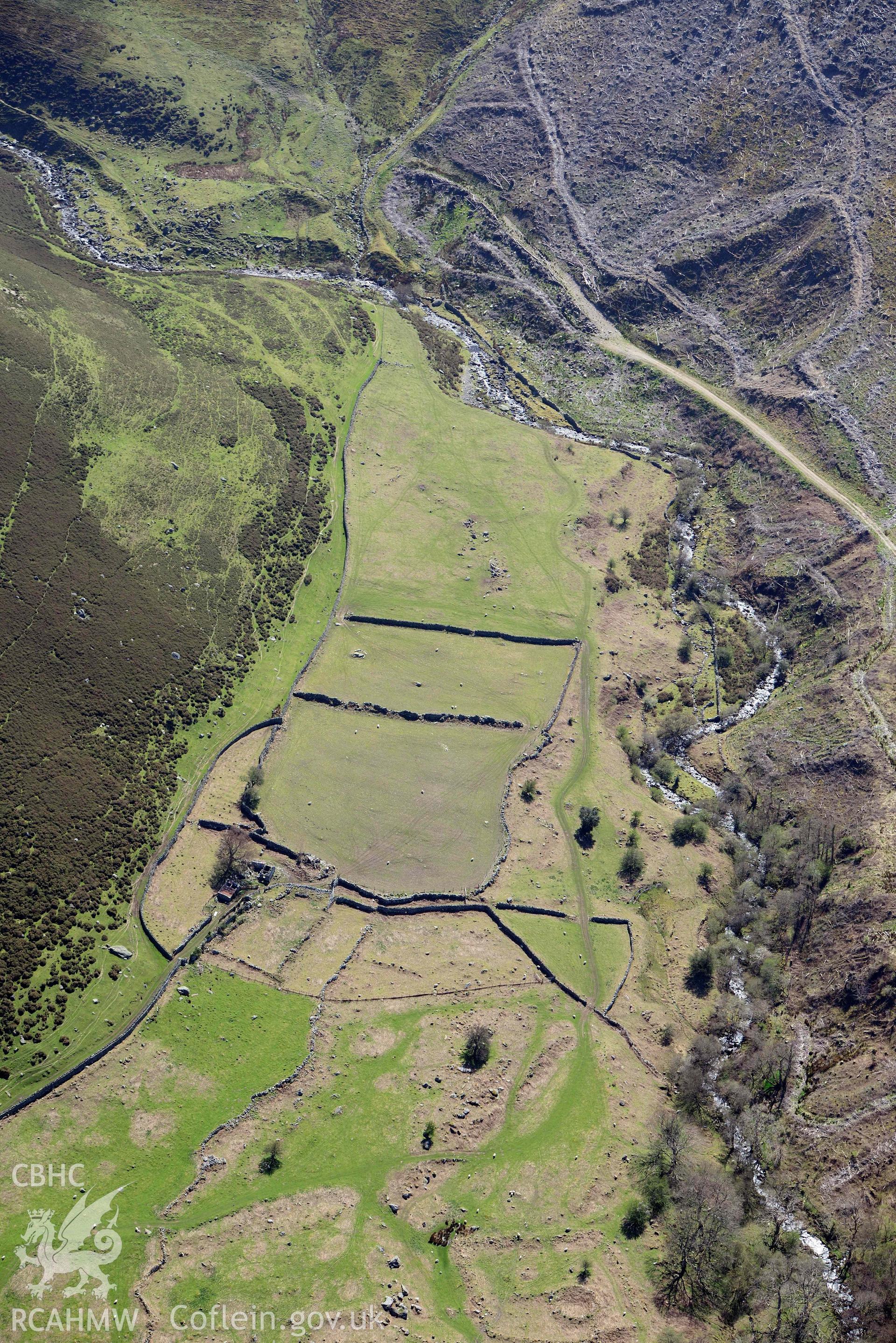 Hafod y Gelyn farmstead and fields, view from north. Oblique aerial photograph taken during the Royal Commission’s programme of archaeological aerial reconnaissance by Toby Driver on 20 April 2018.