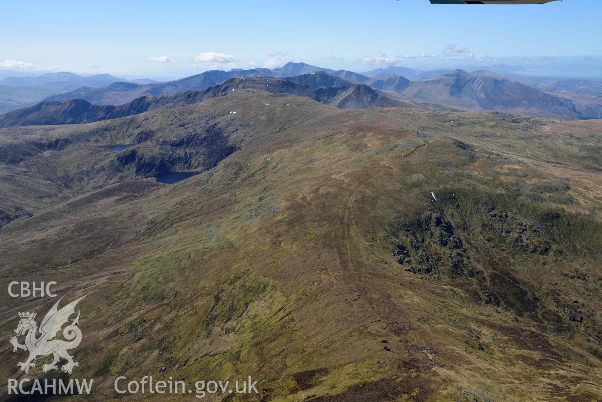 Foel-fras mountain landscape, looking south. Oblique aerial photograph taken during the Royal Commission’s programme of archaeological aerial reconnaissance by Toby Driver on 20 April 2018.