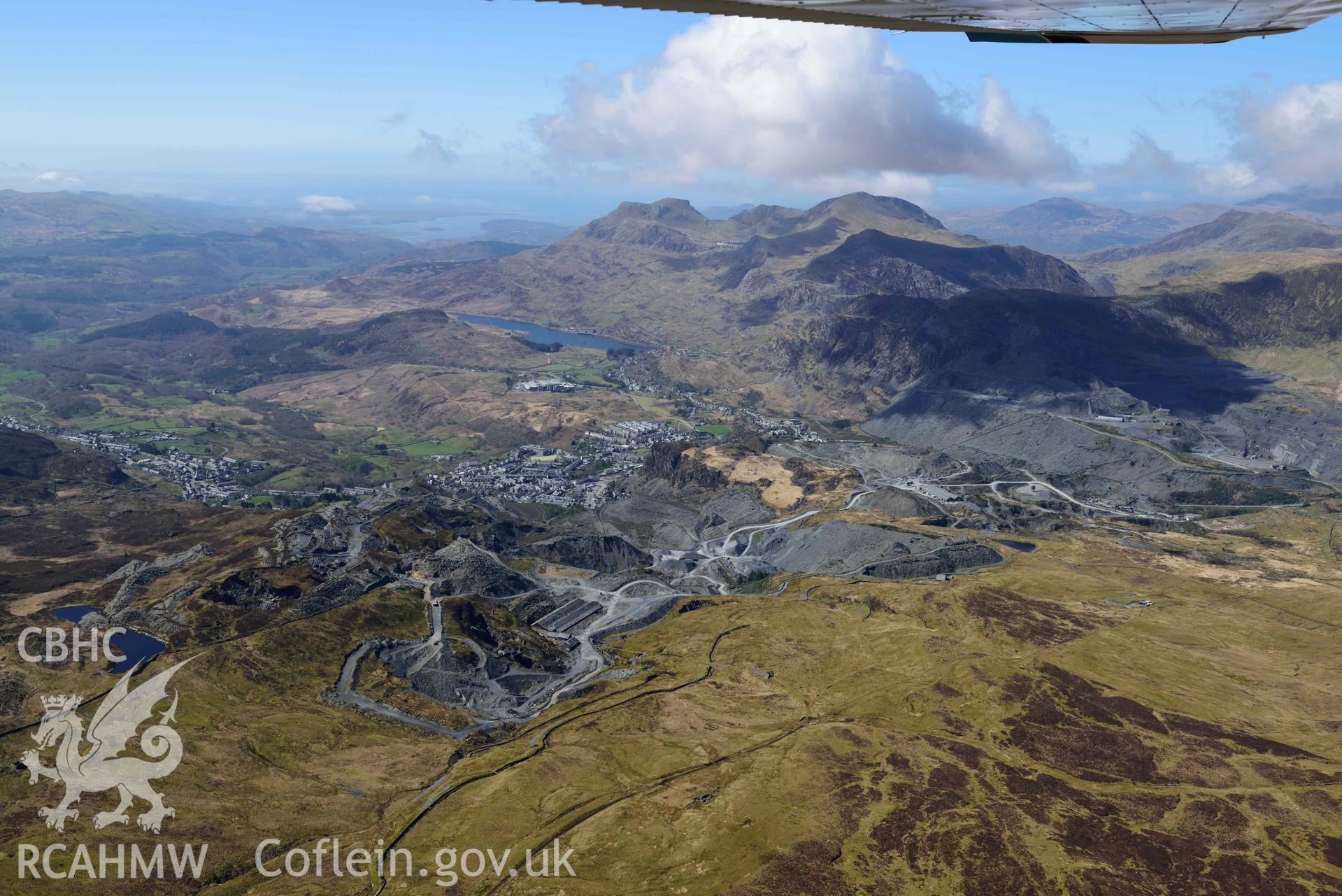 Maen-offeren Slate Quarry, wide view from north-east. Oblique aerial photograph taken during the Royal Commission’s programme of archaeological aerial reconnaissance by Toby Driver on 20 April 2018.