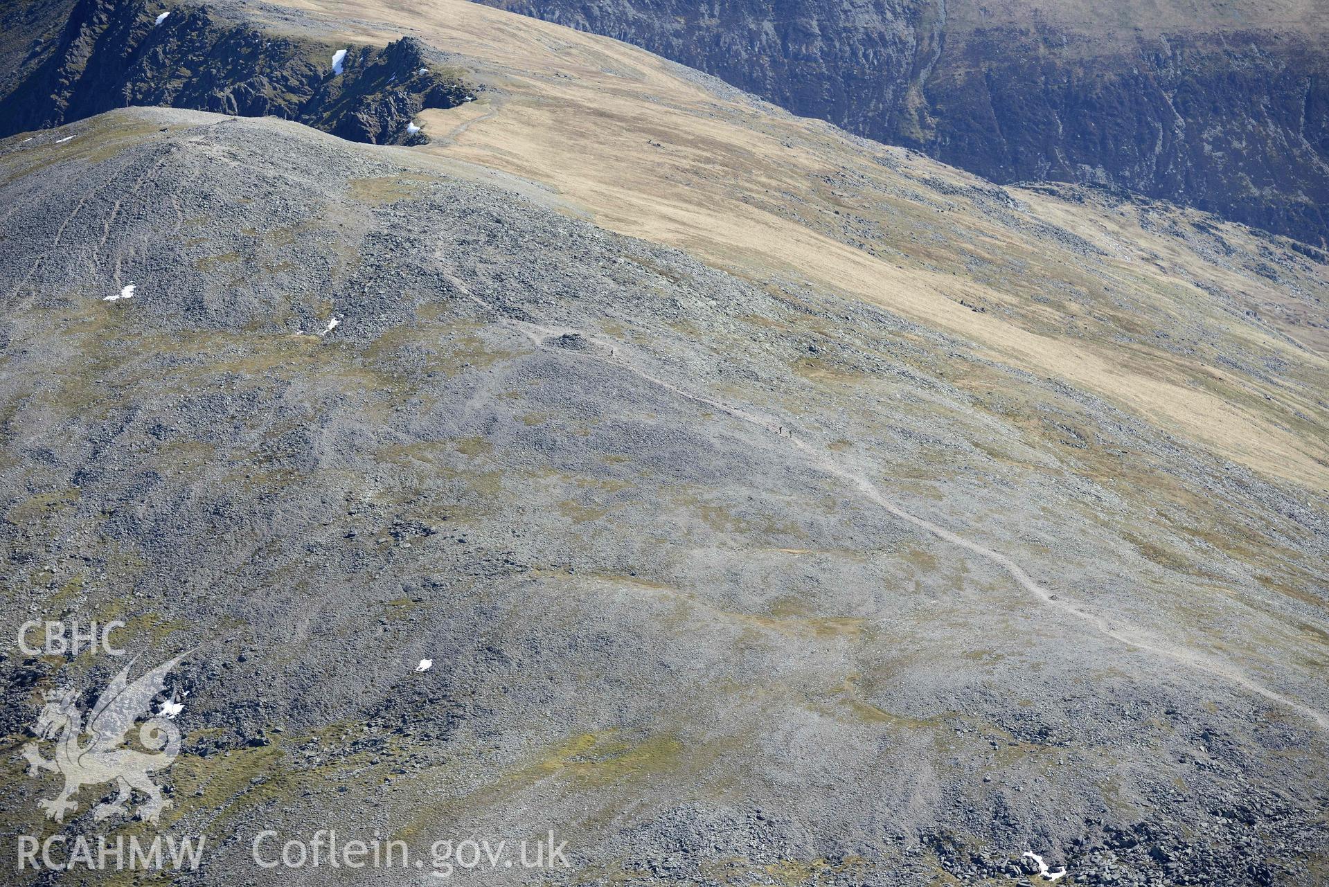 Carnedd Dafydd, cairn to south-west of summit, and summit cairn, view from west. Oblique aerial photograph taken during the Royal Commission’s programme of archaeological aerial reconnaissance by Toby Driver on 20 April 2018.