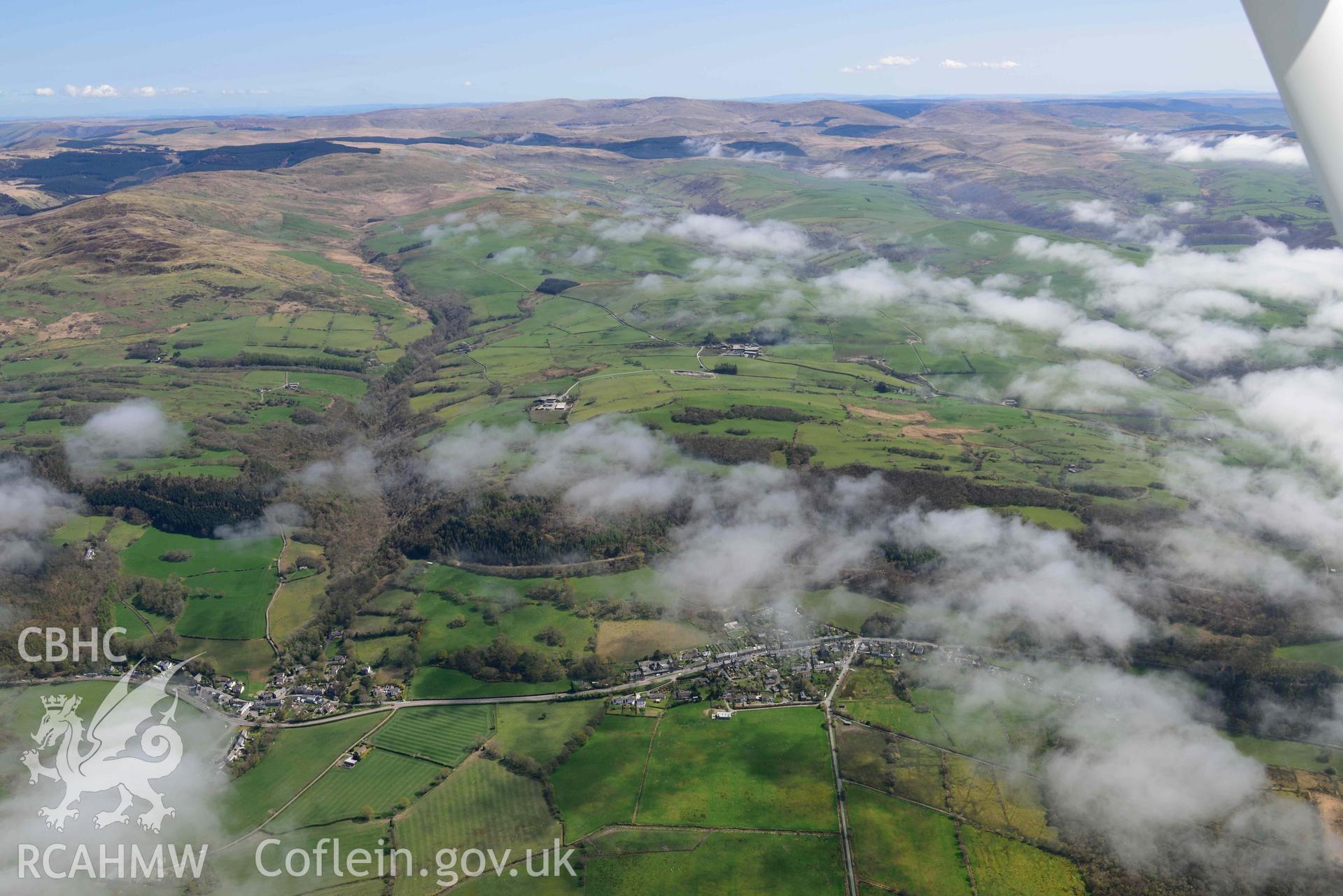 Tre Taliesin and Tre'r Ddol villages, vew from west. Oblique aerial photograph taken during the Royal Commission’s programme of archaeological aerial reconnaissance by Toby Driver on 20 April 2018.