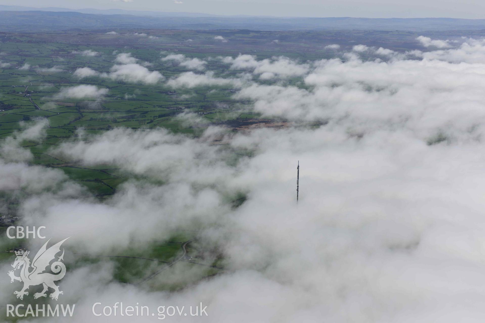 Blaenplwyf, transmitter, with sea fog, view from north-west. Oblique aerial photograph taken during the Royal Commission’s programme of archaeological aerial reconnaissance by Toby Driver on 20 April 2018.