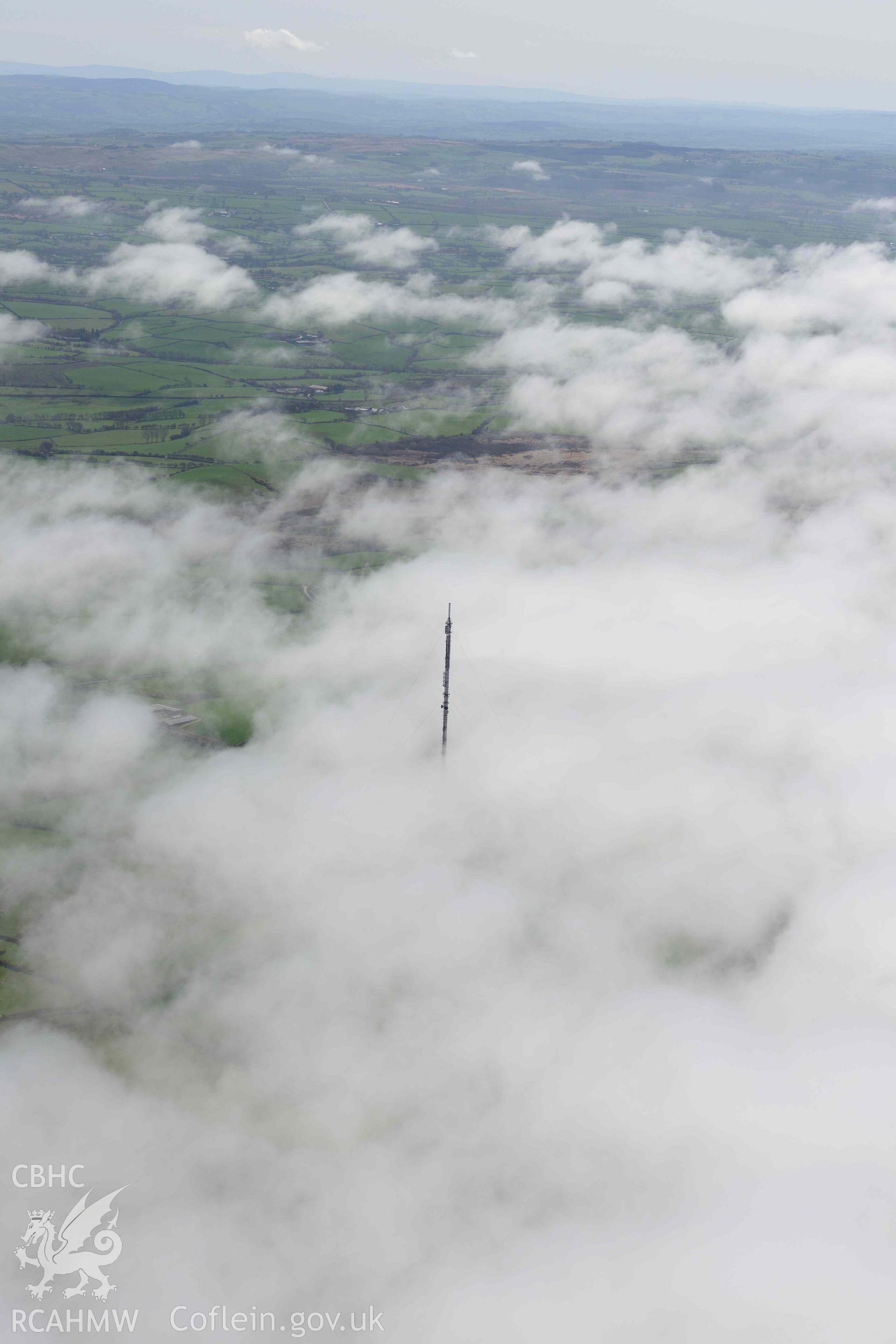 Blaenplwyf, transmitter, with sea fog, view from north-west. Oblique aerial photograph taken during the Royal Commission’s programme of archaeological aerial reconnaissance by Toby Driver on 20 April 2018.