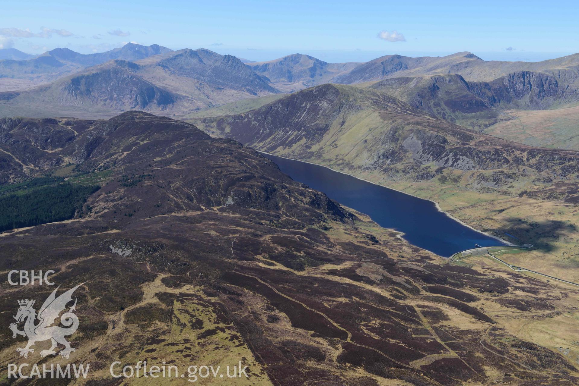 Llyn Cowlyd Reservoir, wide landscape from east. Oblique aerial photograph taken during the Royal Commission’s programme of archaeological aerial reconnaissance by Toby Driver on 20 April 2018.