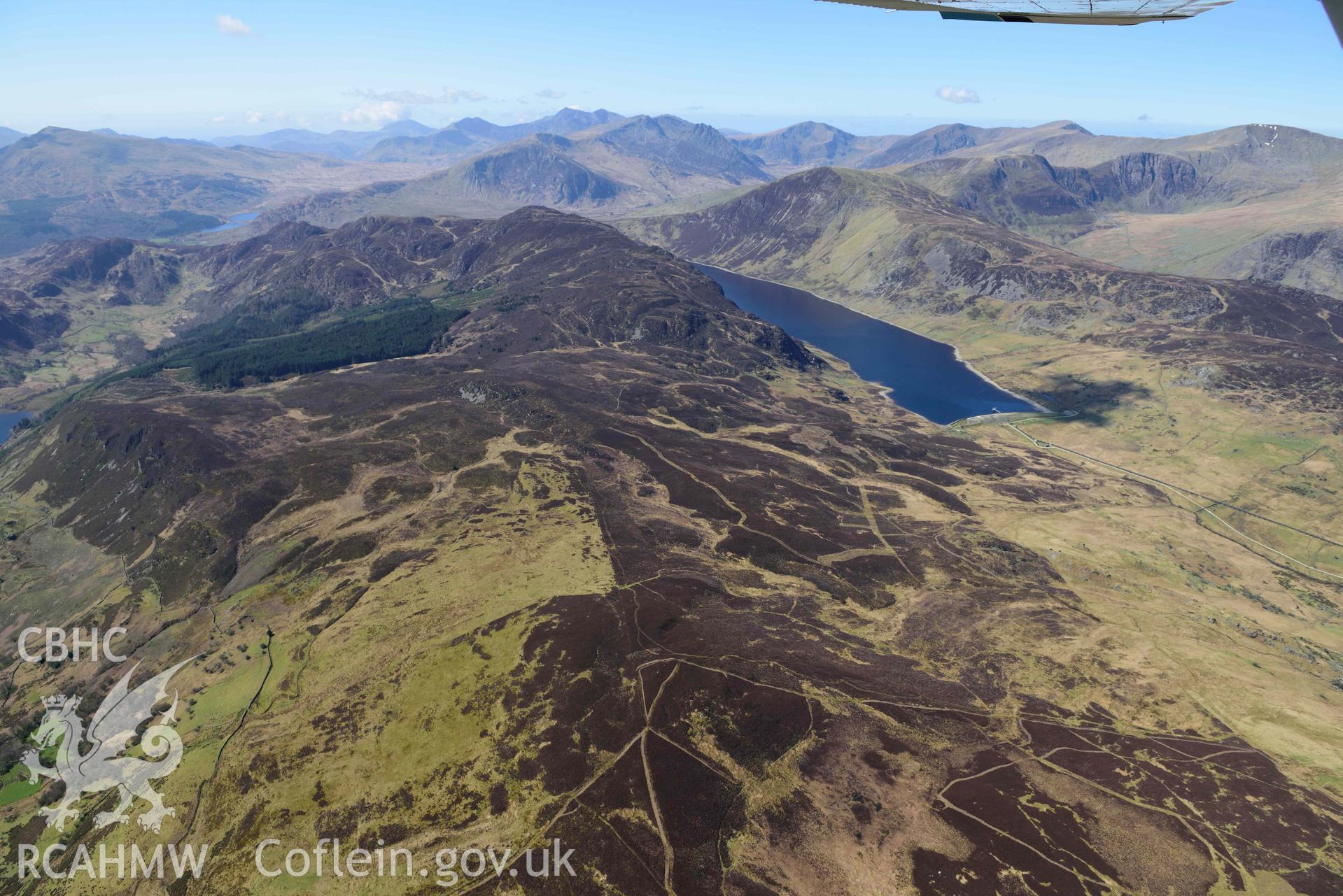 Llyn Cowlyd Reservoir and Cefn Cyfarwydd, wide landscape from east. Oblique aerial photograph taken during the Royal Commission’s programme of archaeological aerial reconnaissance by Toby Driver on 20 April 2018.