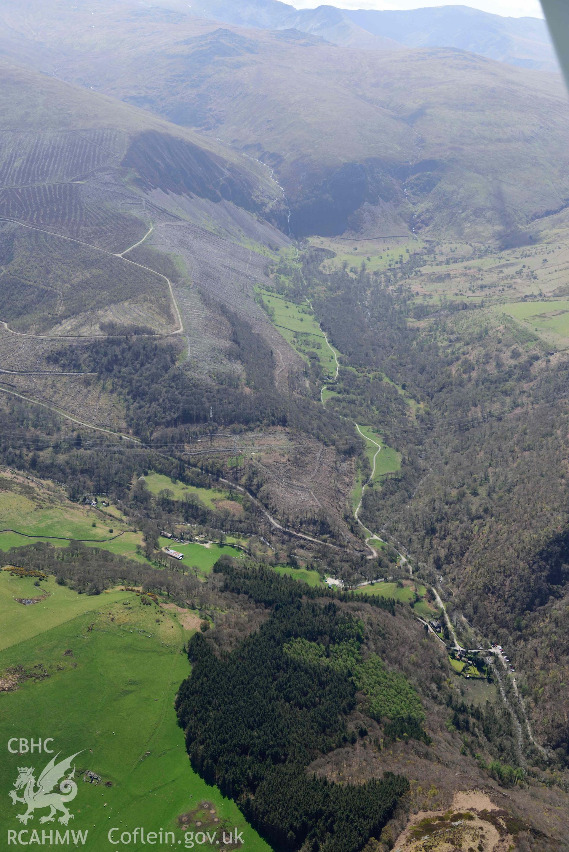Coedydd Aber Nature Reserve, landscape view from north. Oblique aerial photograph taken during the Royal Commission’s programme of archaeological aerial reconnaissance by Toby Driver on 20 April 2018.