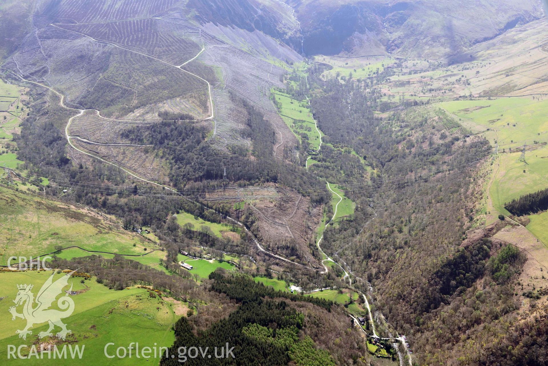 Coedydd Aber Nature Reserve, landscape view from north. Oblique aerial photograph taken during the Royal Commission’s programme of archaeological aerial reconnaissance by Toby Driver on 20 April 2018.