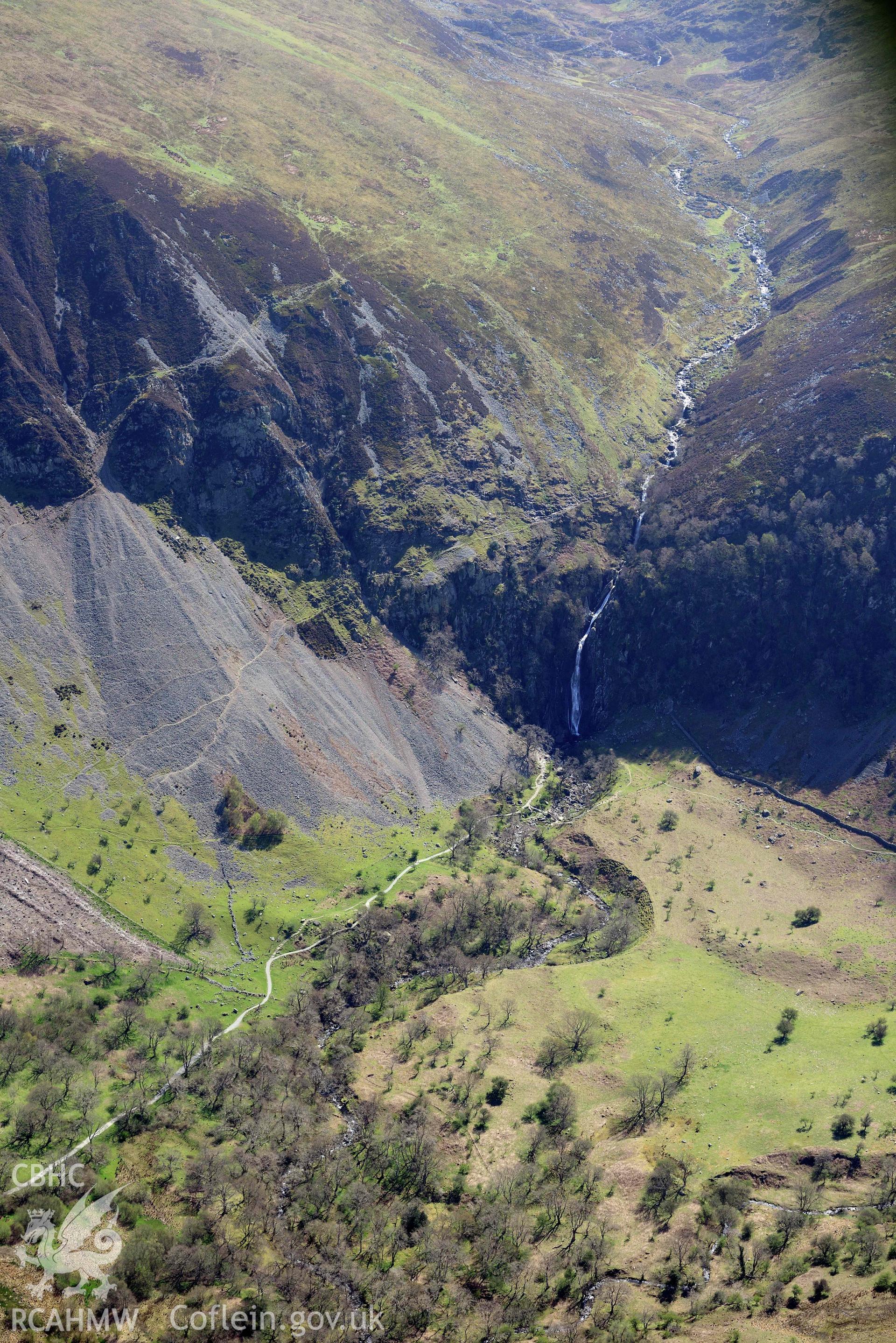 Coedydd Aber Nature Reserve; Aber Falls and landscape from north-west. Oblique aerial photograph taken during the Royal Commission’s programme of archaeological aerial reconnaissance by Toby Driver on 20 April 2018.