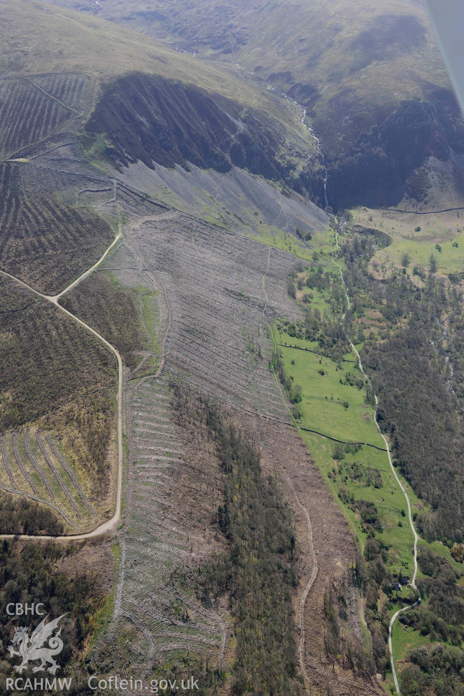 Coedydd Aber Nature Reserve, landscape view from north. Oblique aerial photograph taken during the Royal Commission’s programme of archaeological aerial reconnaissance by Toby Driver on 20 April 2018.