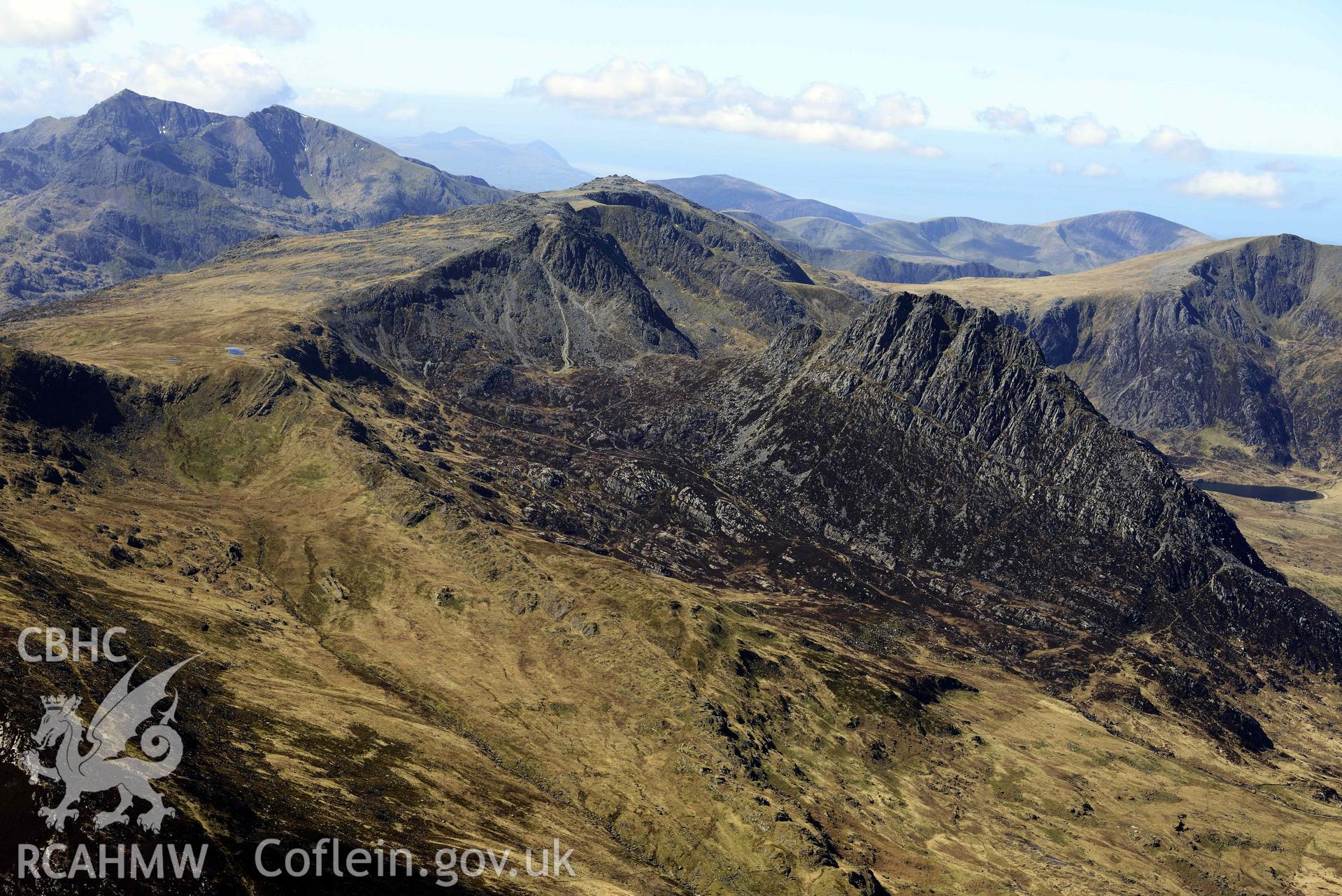 Tryfan and Glyder Fach, view looking south-west to Yr Wyddfa/Snowdon. Oblique aerial photograph taken during the Royal Commission’s programme of archaeological aerial reconnaissance by Toby Driver on 20 April 2018.