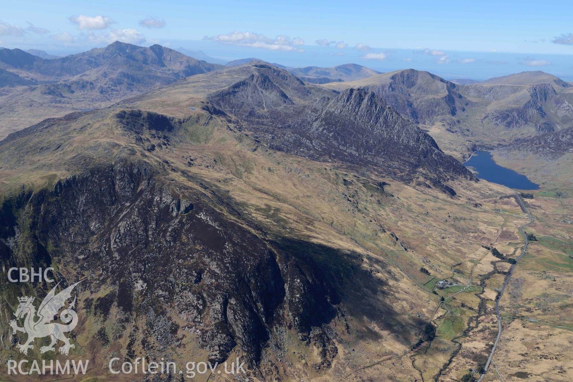 Tryfan and Glyder Fach, view looking south-west to Yr Wyddfa/Snowdon. Oblique aerial photograph taken during the Royal Commission’s programme of archaeological aerial reconnaissance by Toby Driver on 20 April 2018.