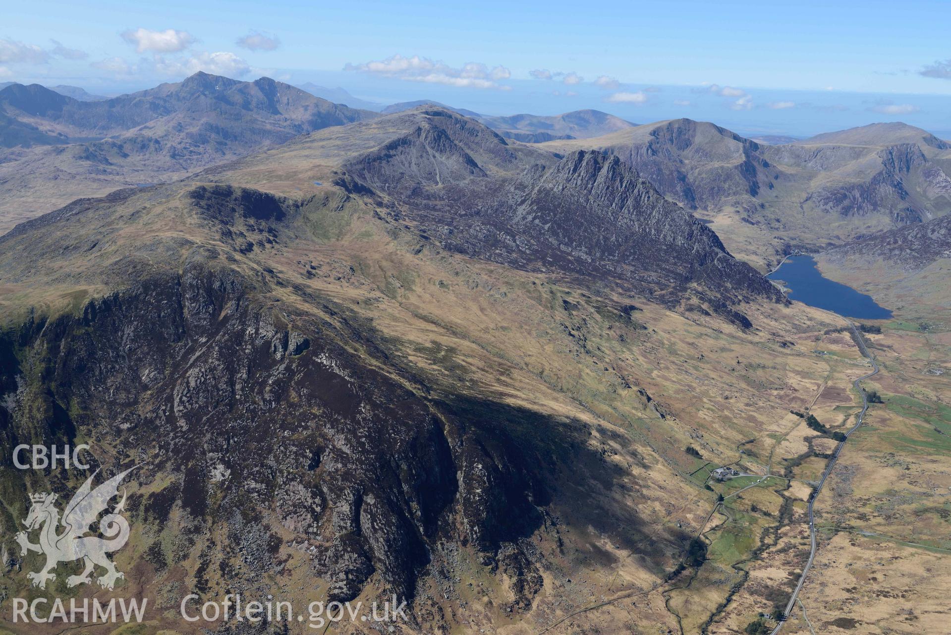Tryfan and Glyder Fach, view looking south-west to Yr Wyddfa/Snowdon. Oblique aerial photograph taken during the Royal Commission’s programme of archaeological aerial reconnaissance by Toby Driver on 20 April 2018.