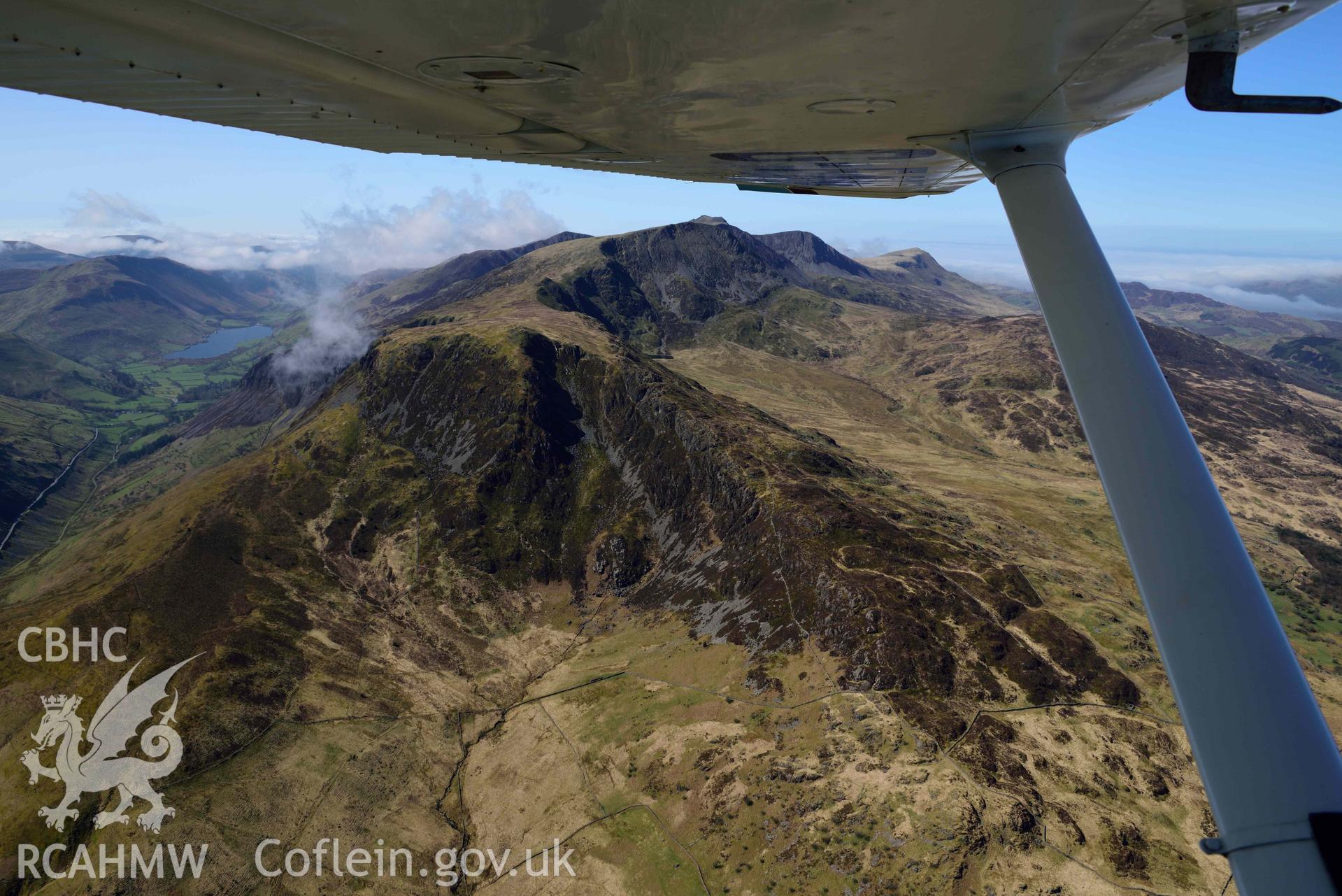 Cader Idris landscape, view over Gau Graig from north-east, with aircraft wing. Oblique aerial photograph taken during the Royal Commission’s programme of archaeological aerial reconnaissance by Toby Driver on 20 April 2018.