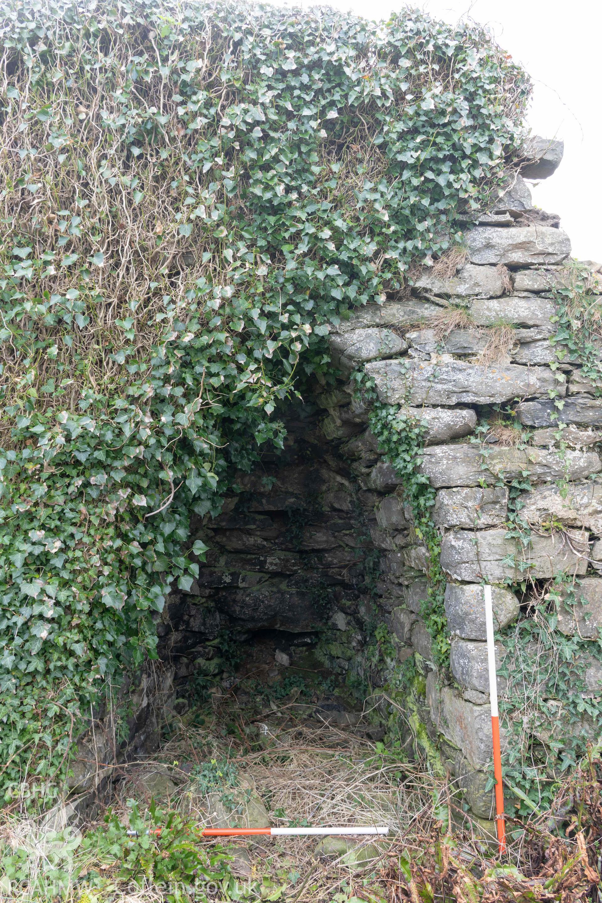 Kiln 4, kiln-eye, north elevation (with scale). Part of photographic survey of Aberstrincell lime kilns and coal yard, conducted by Louise Barker of the RCAHMW survey team on 21 March 2024.