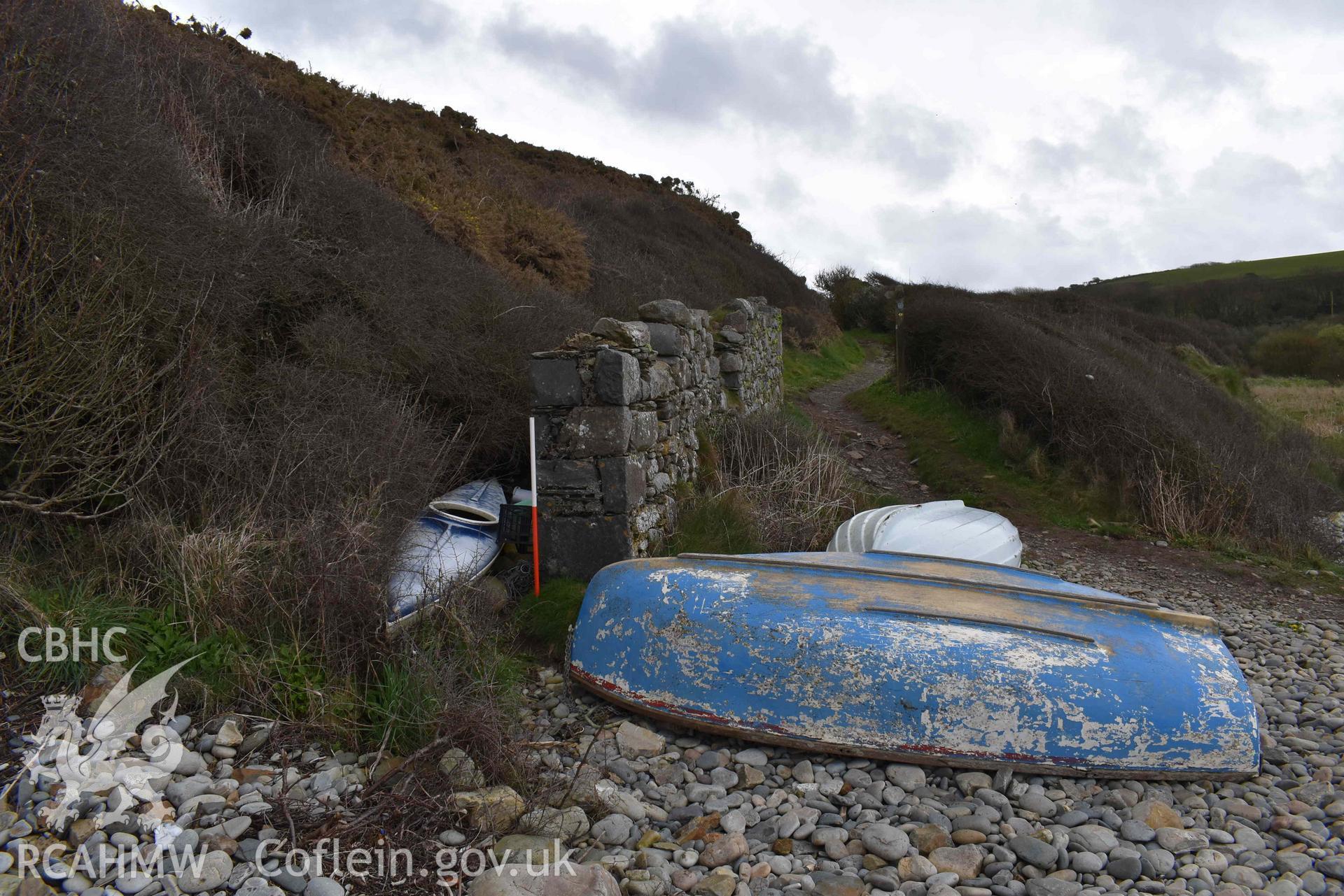 Seaward (western) end of the ruined boathouse at Aber Bach on 02/04/2024. Scale is 1m. Produced by Julian Whitewright of the RCAHMW Survey Team.