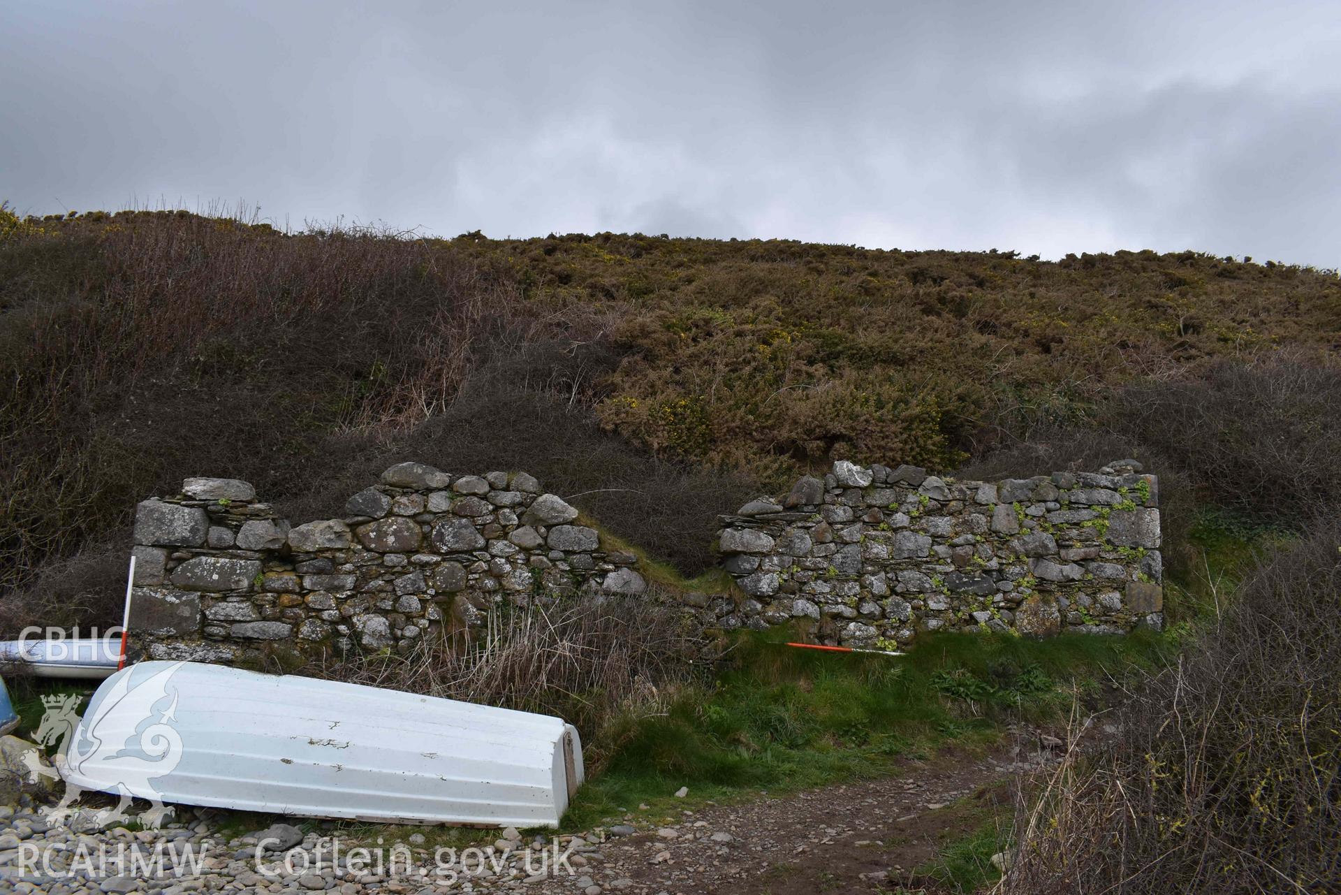 South-facing elevation of the ruined boathouse at Aber Bach on the 02/04/2024. Scales are 1m. Produced by Julian Whitewright of the RCAHMW Survey Team.