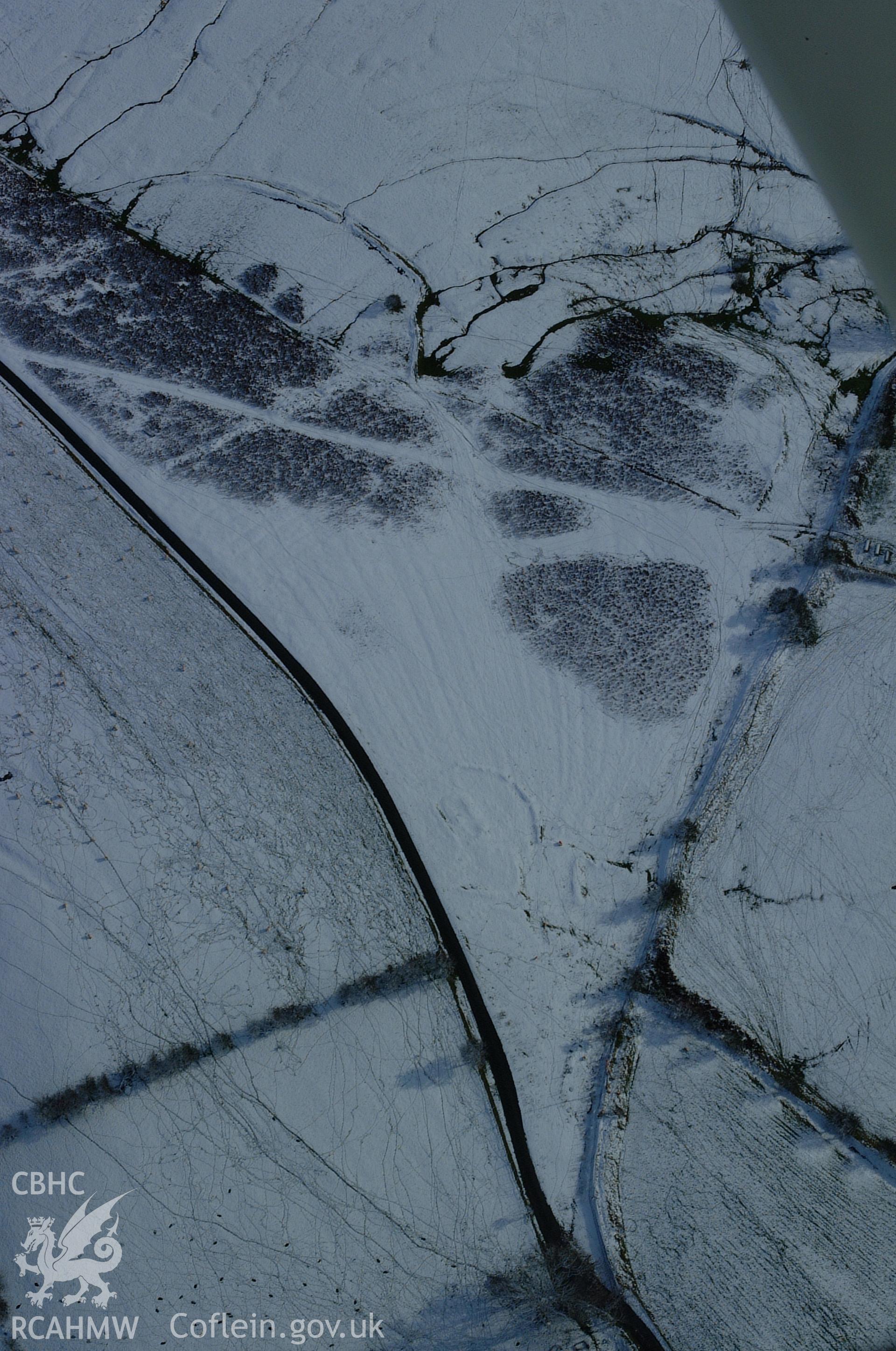RCAHMW colour oblique aerial photograph of the western part of Fron Top Deserted Rural Settlement from the west. Taken on 19 November 2004 by Toby Driver