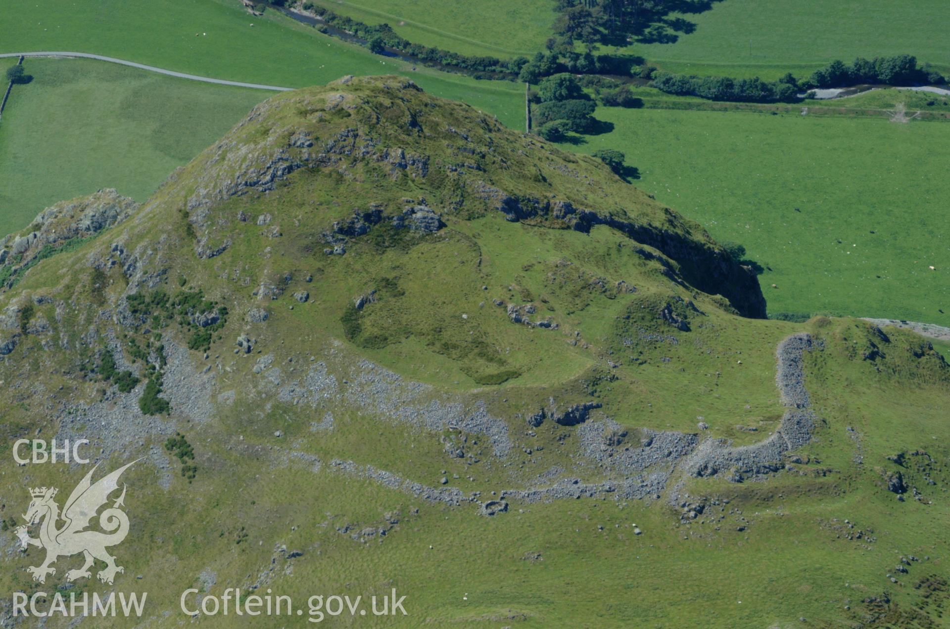RCAHMW colour oblique aerial photograph of Craig-y-deryn Hillfort taken on 14/06/2004 by Toby Driver