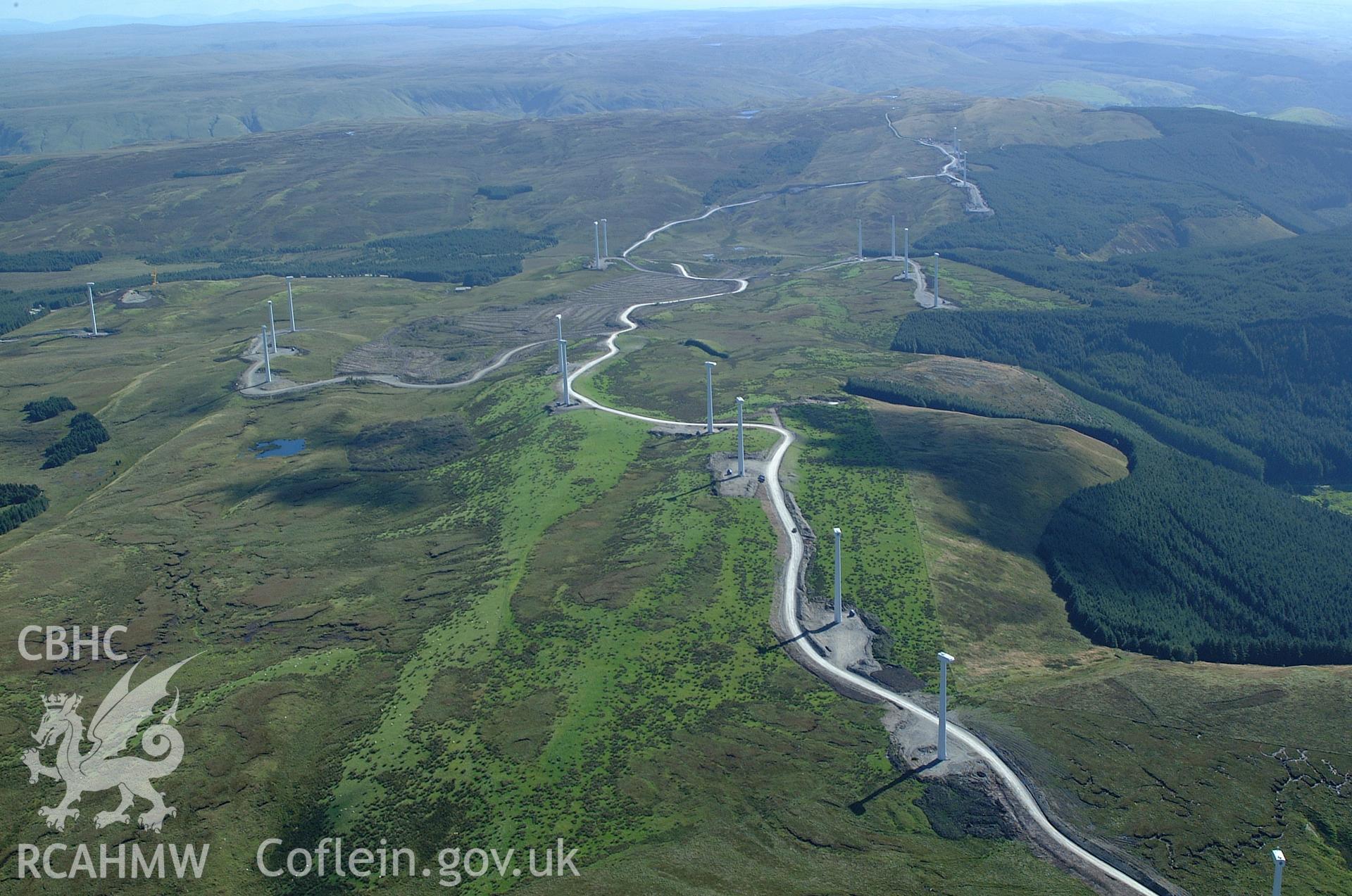 RCAHMW colour oblique aerial photograph of Cefn Croes Wind Farm during construction, from the north. Taken on 31 August 2004 by Toby Driver