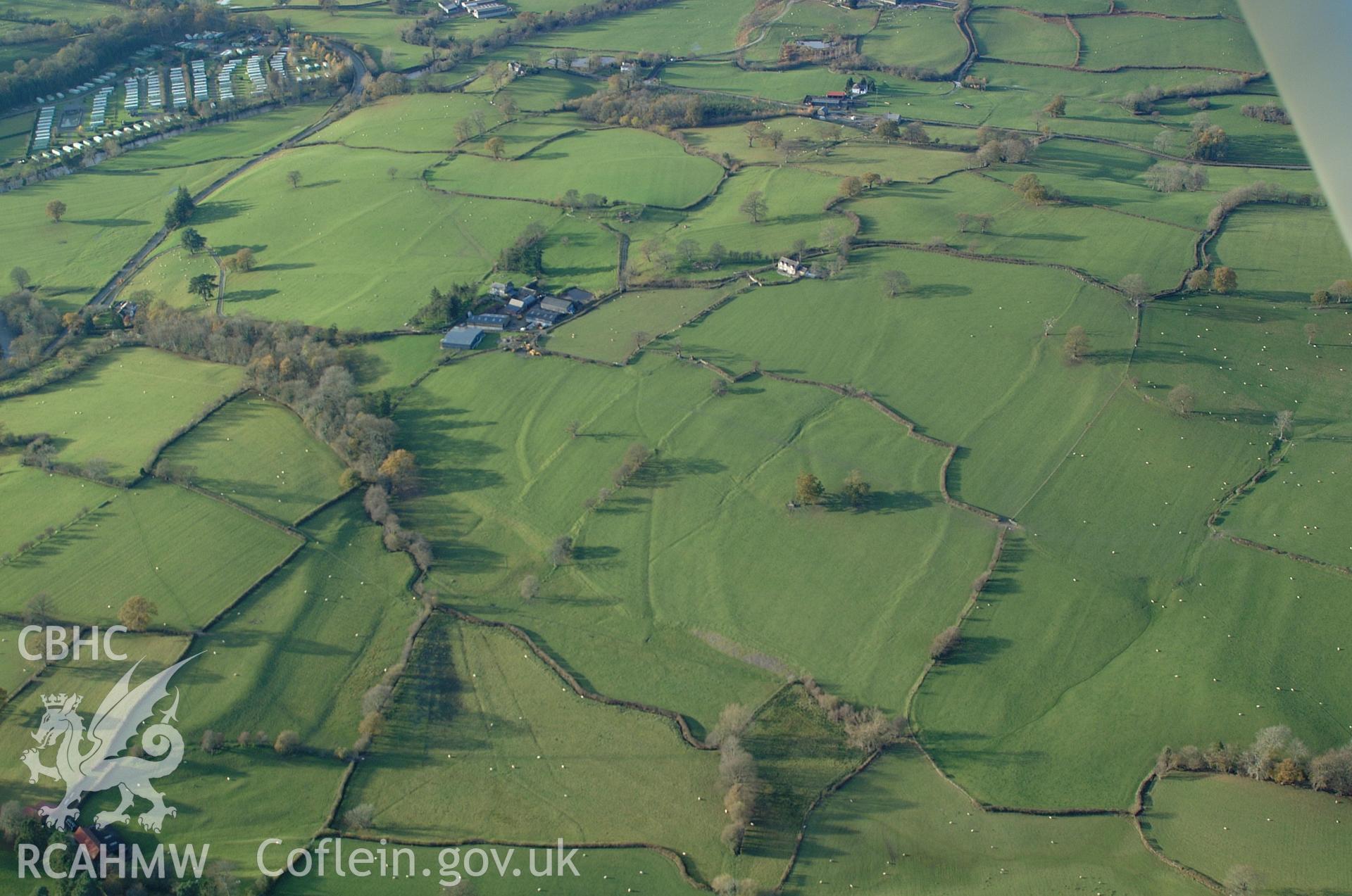 RCAHMW colour oblique aerial photograph of Pentre-Isaf Medieval Strip Field System, Llanfair Caereinion, viewed from the south-east. Taken on 19 November 2004 by Toby Driver