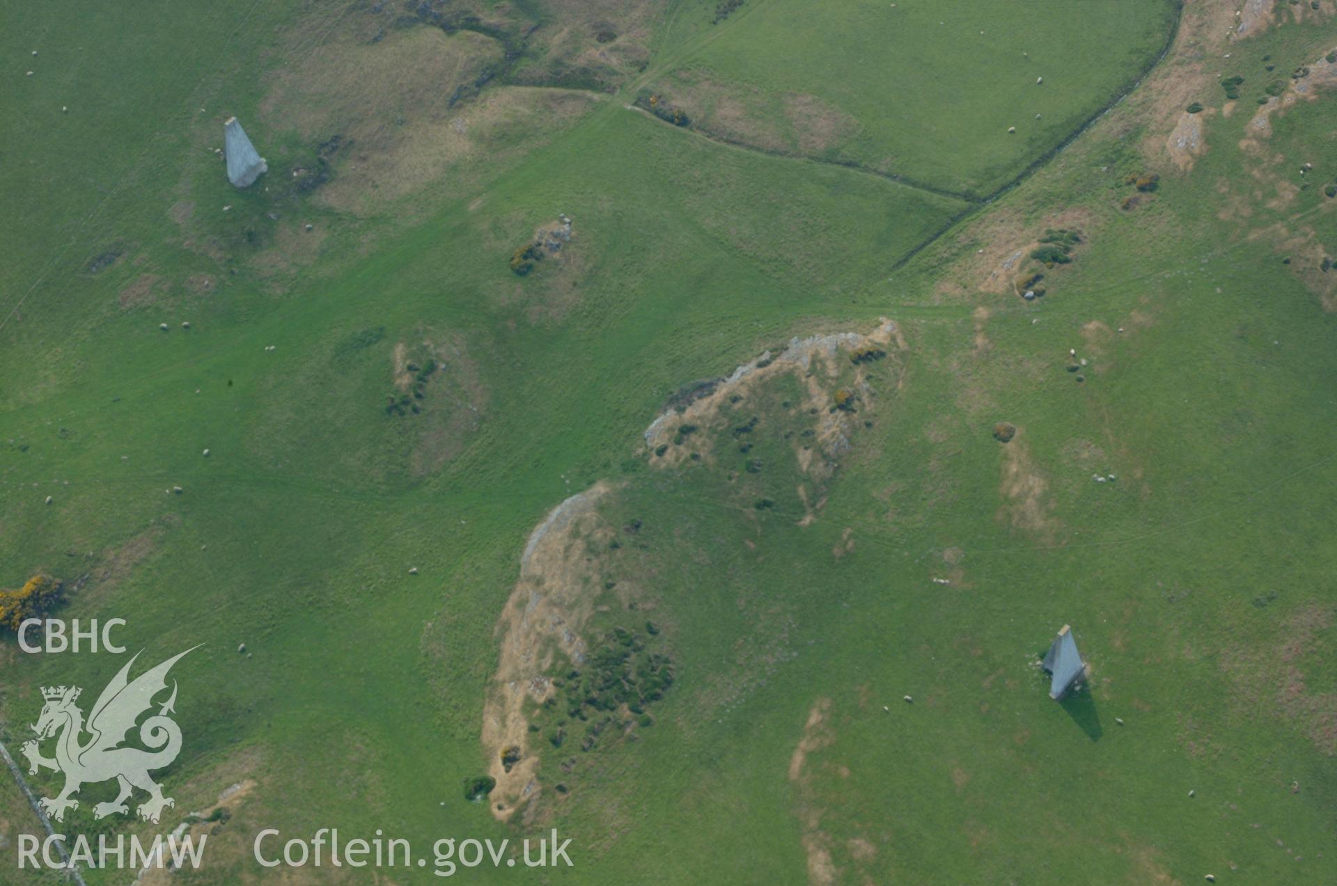 RCAHMW colour oblique aerial photograph of Pilot Beacons, Carmel Head. Taken on 26 May 2004 by Toby Driver