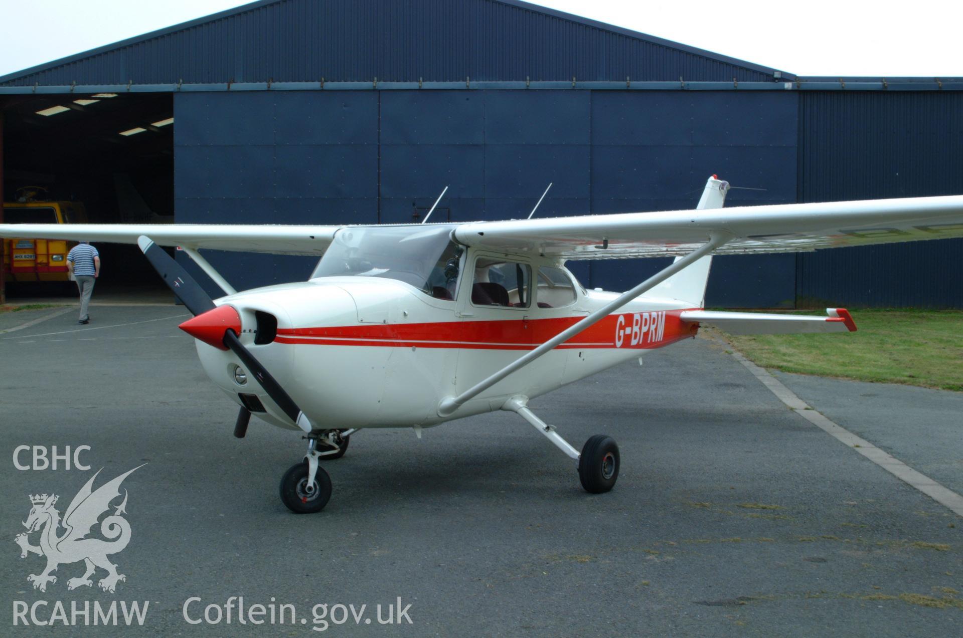 RCAHMW colour oblique aerial photograph of Montgomeryshire Mid Wales Airport, views of aircraft for lecture purposes Taken on 08 June 2004 by Toby Driver