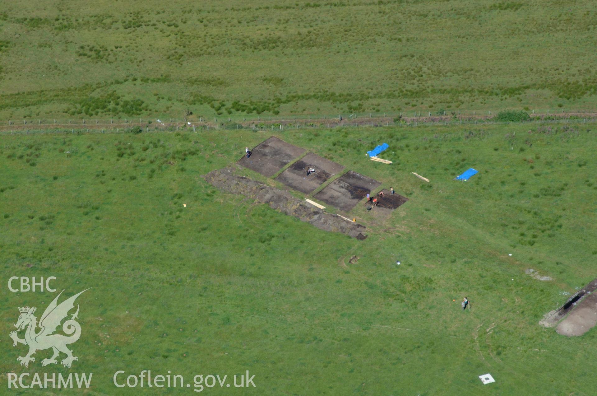 RCAHMW colour oblique aerial photograph of Llangynfelin Timber Trackway taken on 14/06/2004 by Toby Driver