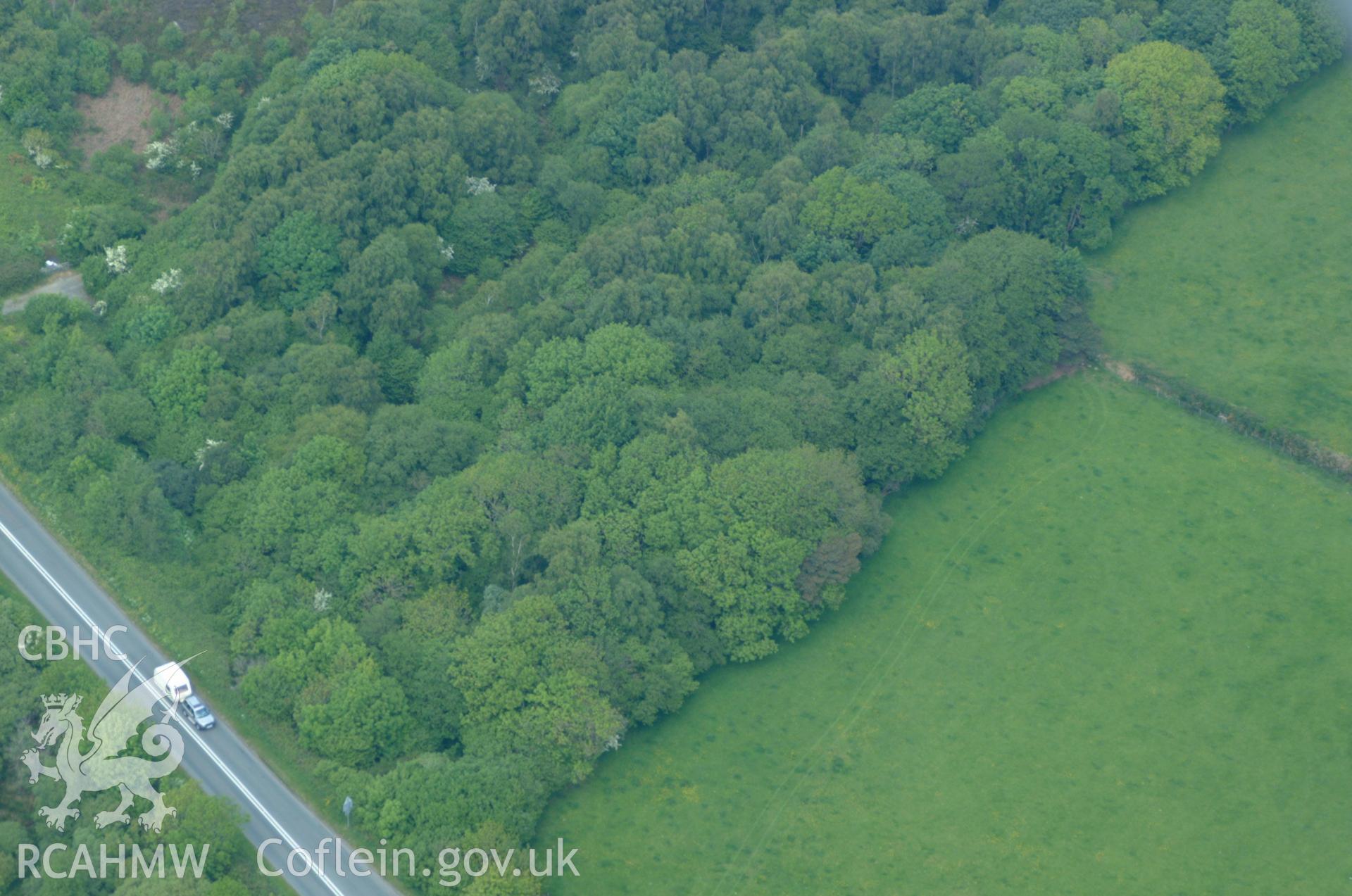 RCAHMW colour oblique aerial photograph of a burnt mound west of Plas Lligwy taken on 26/05/2004 by Toby Driver
