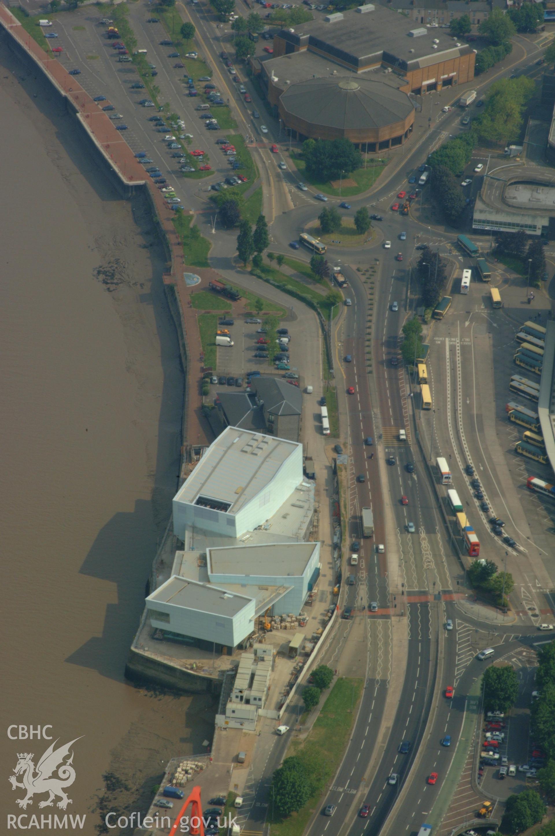 RCAHMW colour oblique aerial photograph of the site of the  Newport Medieval Ship and the Riverfront Arts Centre taken on 26/05/2004 by Toby Driver