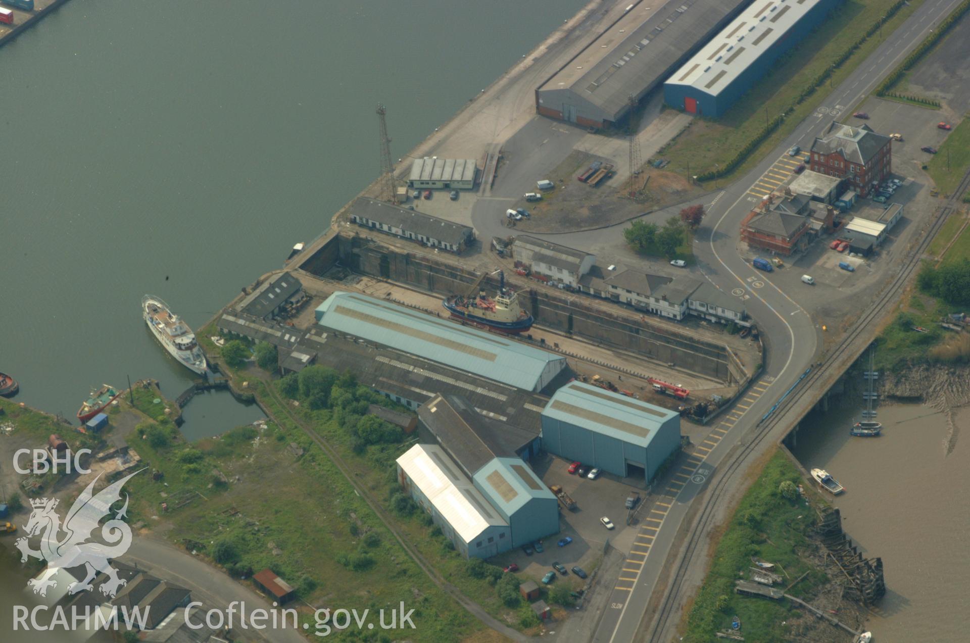 RCAHMW colour oblique aerial photograph of Newport Docks, Graving Dock. Taken on 26 May 2004 by Toby Driver