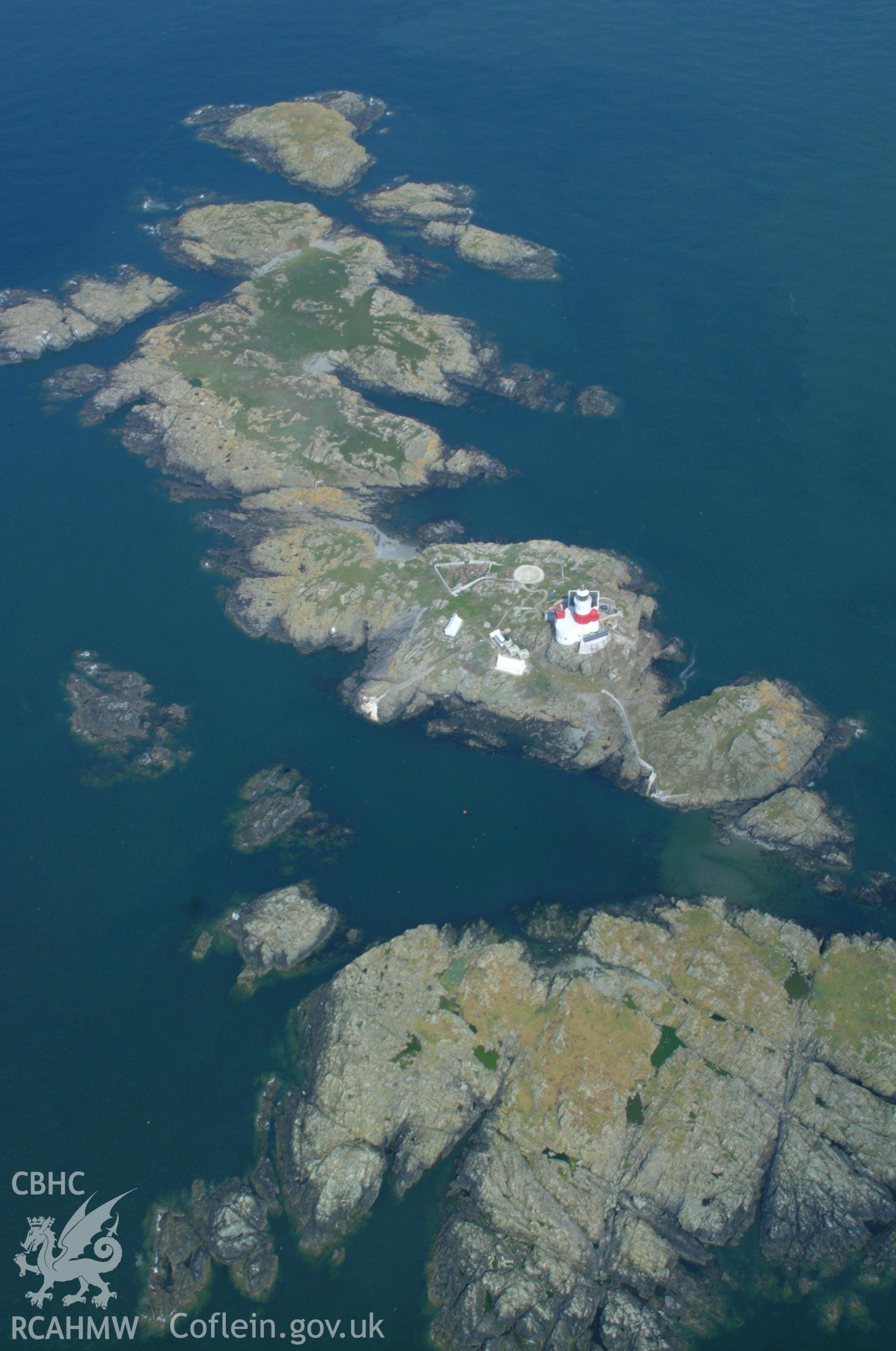 RCAHMW colour oblique aerial photograph of the Skerries Lighthouse taken on 26/05/2004 by Toby Driver