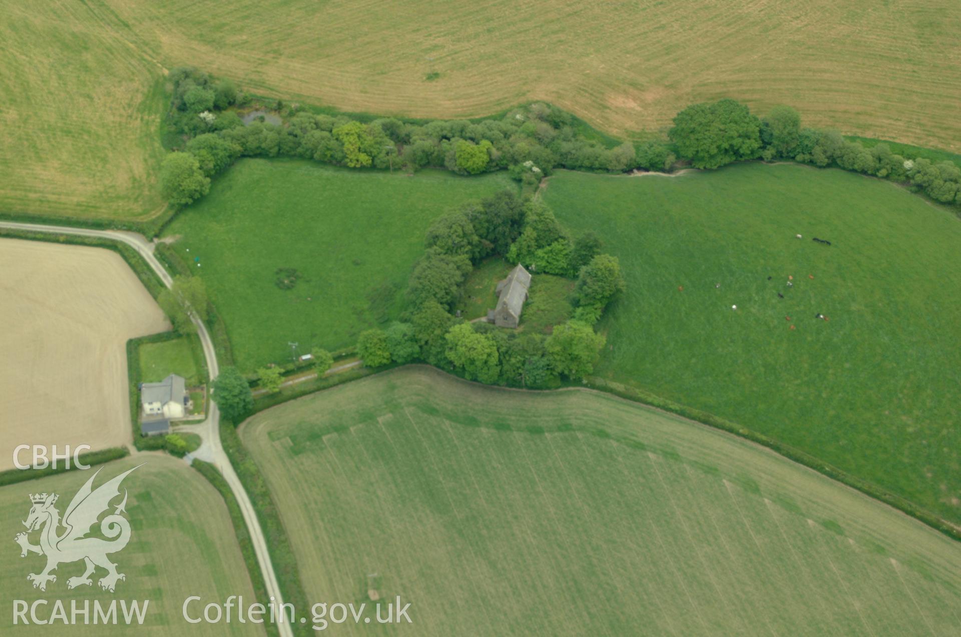 RCAHMW colour oblique aerial photograph of Llangan Church taken on 24/05/2004 by Toby Driver