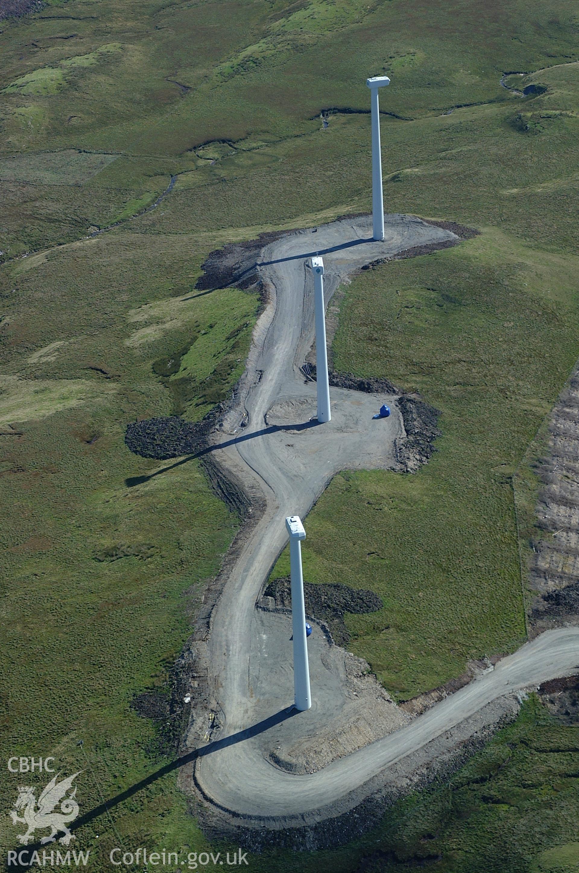 RCAHMW colour oblique aerial photograph of Cefn Croes Wind Farm during construction, from the north. Taken on 31 August 2004 by Toby Driver