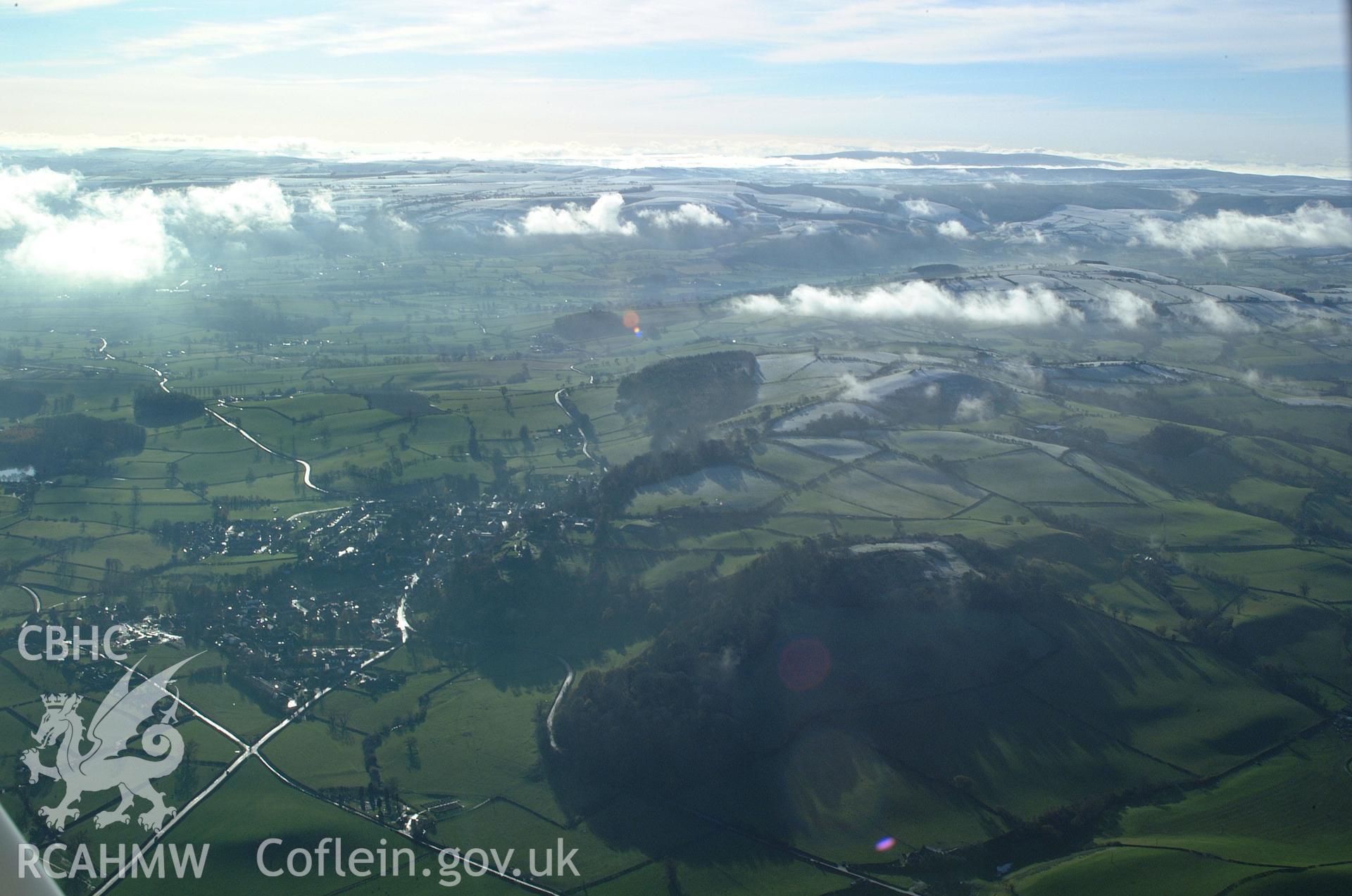 RCAHMW colour oblique aerial photograph of Ffridd Faldwyn hillfort, viewed from the north with Montgomery beyond. Taken on 19 November 2004 by Toby Driver