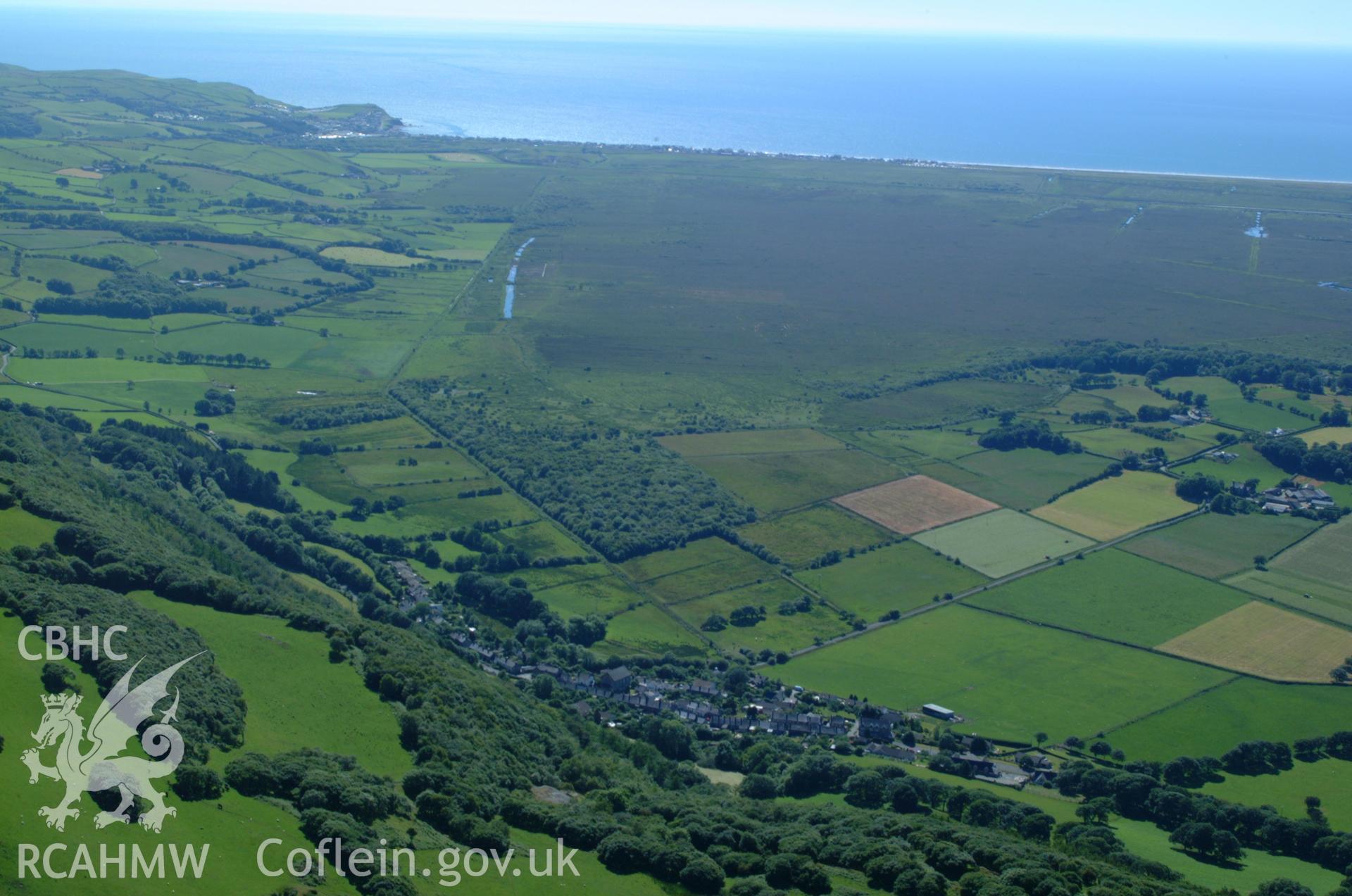 RCAHMW colour oblique aerial photograph of Tre Taliesin Village taken on 14/06/2004 by Toby Driver