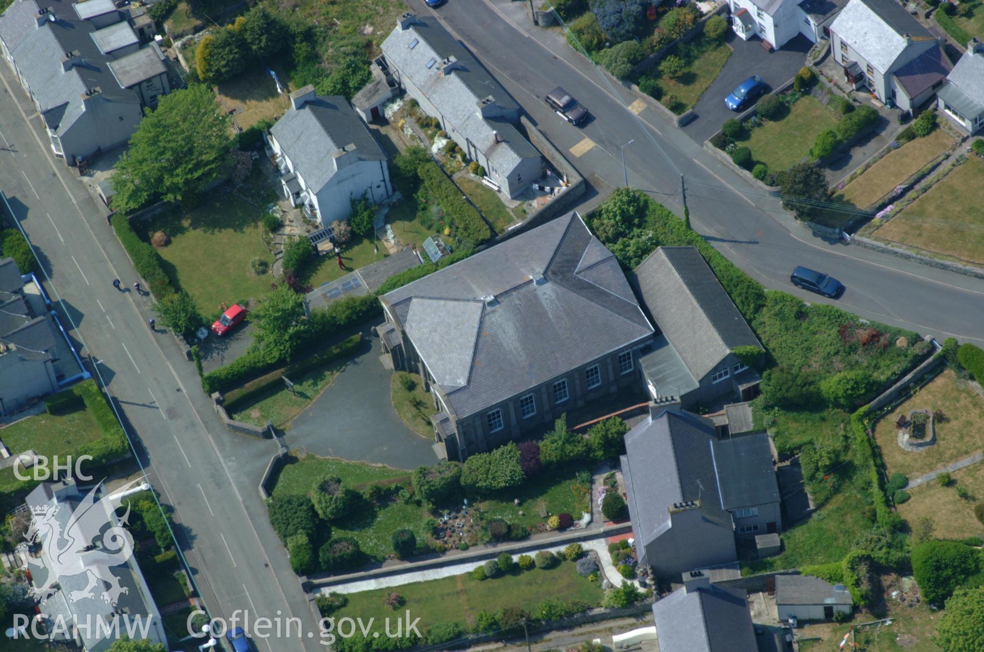 RCAHMW colour oblique aerial photograph of Peniel Chapel, Llaneilian Road, Porth Amlwch taken on 26/05/2004 by Toby Driver