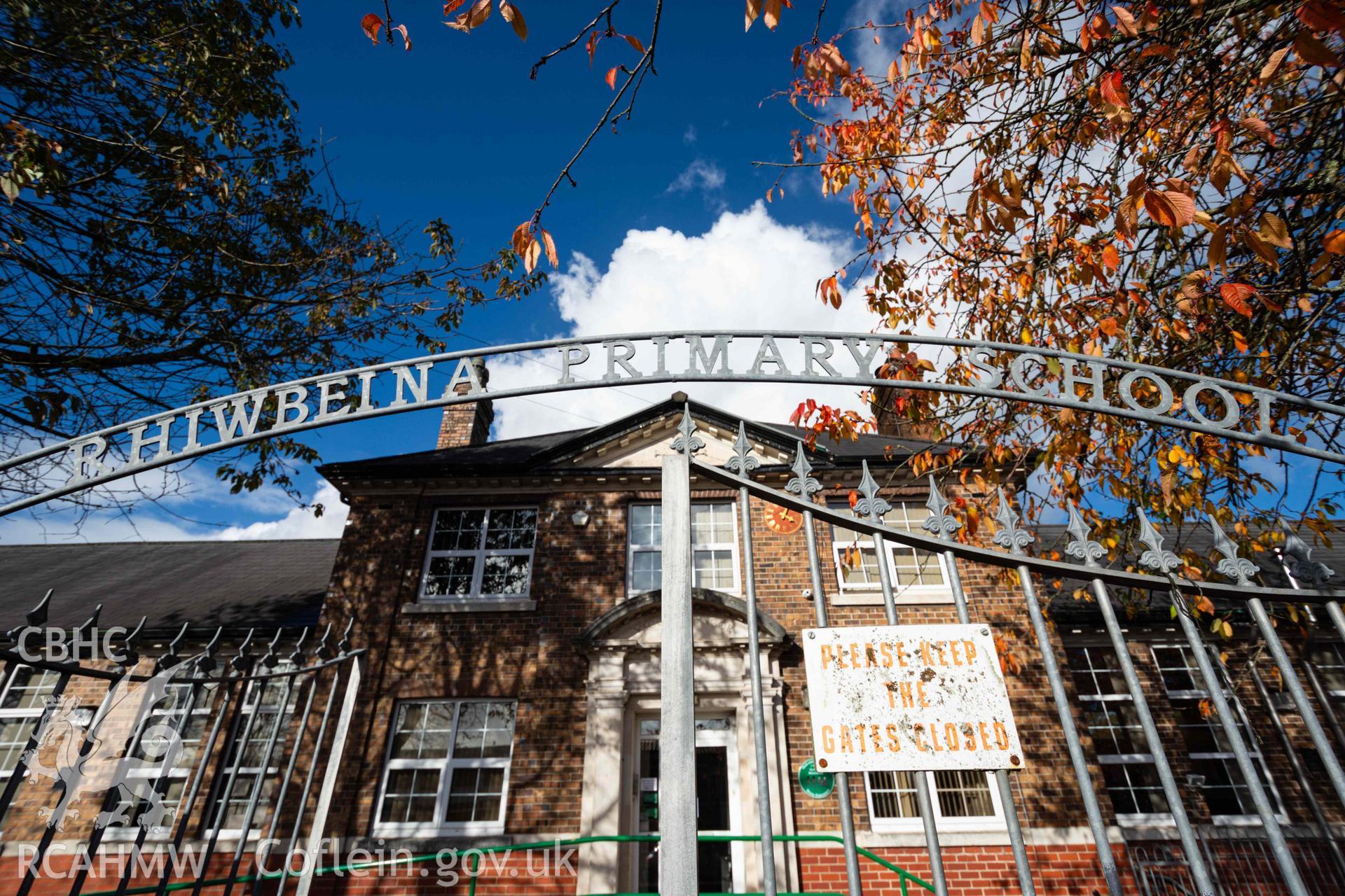 Arched 'Rhiwbeina Primary School' hollowed out above metal gates to main entrance