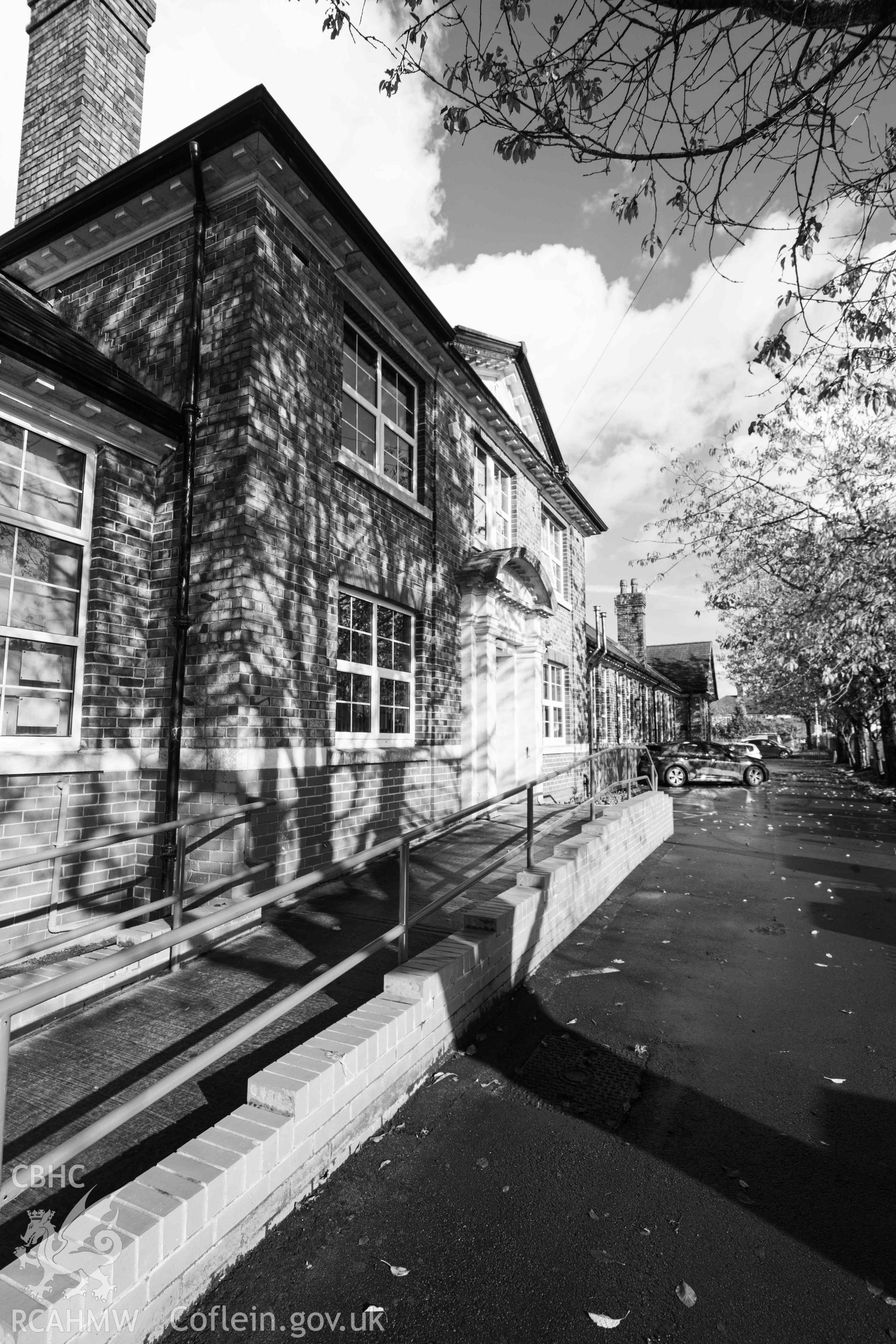 View along front elevations, Rhiwbeina Primary School, looking north east. Black and white, portrait