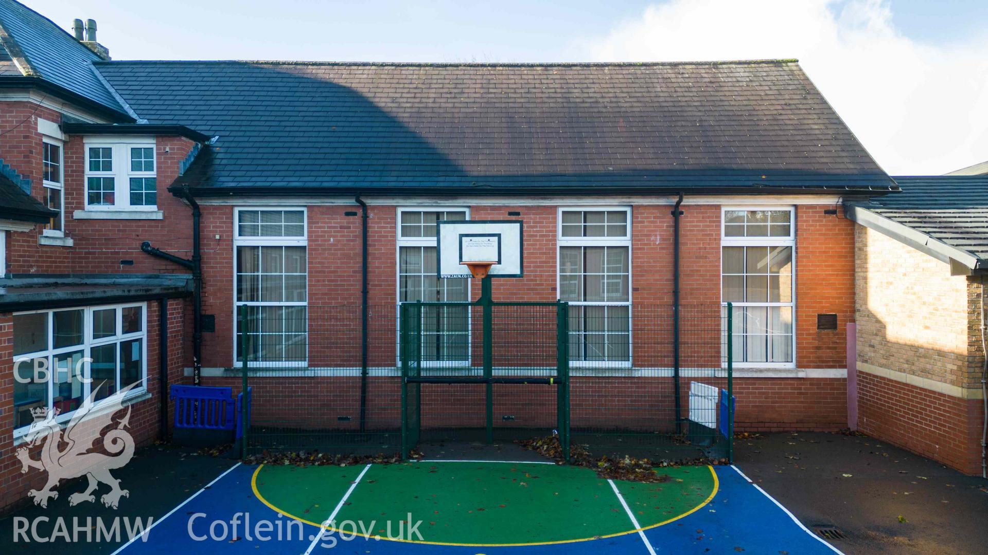 Inner yard, small basketball court. North east elevations of assembly hall, Rhiwbeina Primary School.
