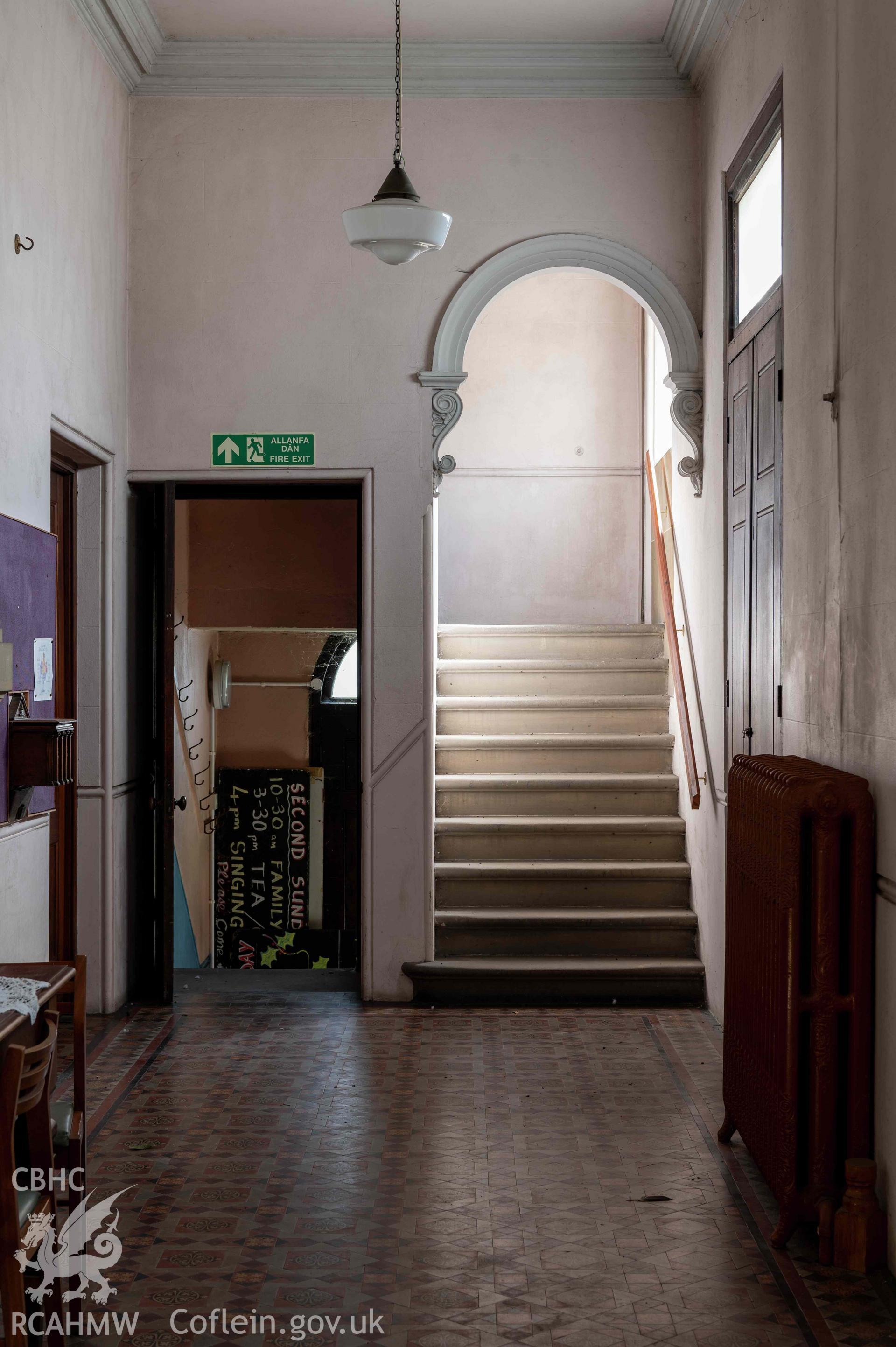 Capel Zion Baptist Chapel, Newtown - vestibule looking north-east, detail of door to basement and archway to gallery stairs.
