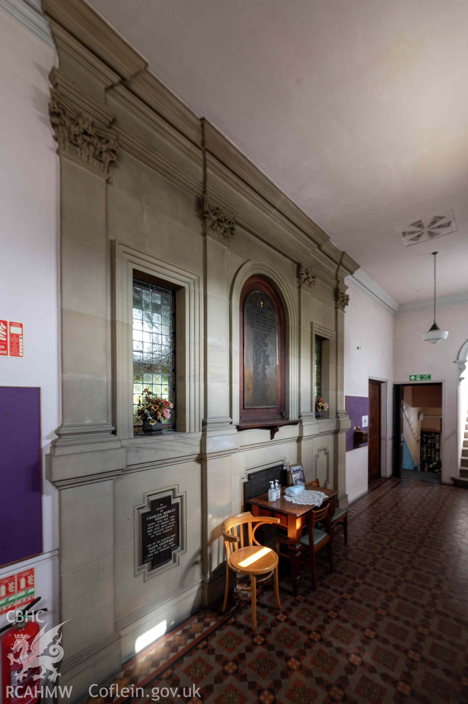 Capel Zion Baptist Chapel, Newtown - vestibule, detail of stone entablature opposite doorways with vestibule windows and memorials.