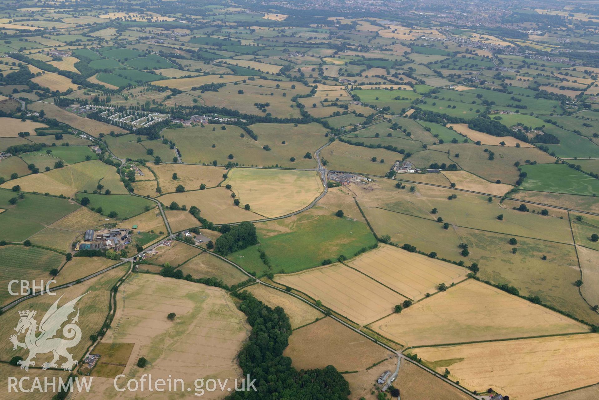 Manor Farmhouse landscape. Oblique aerial photograph taken during the Royal Commission’s programme of archaeological aerial reconnaissance by Toby Driver on 10 July 2018.