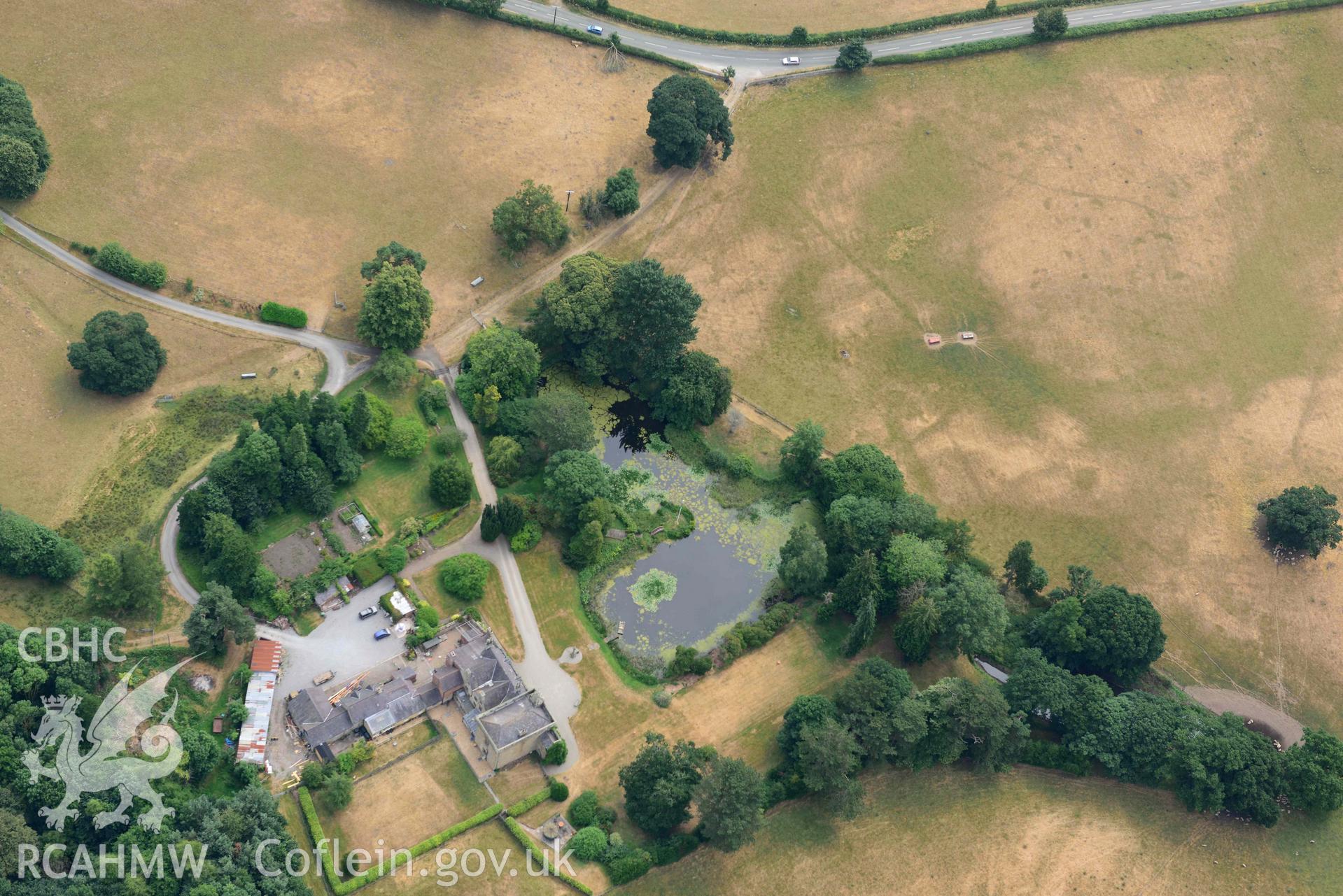 Cropmarks at Tower Garden, Mold. Oblique aerial photograph taken during the Royal Commission’s programme of archaeological aerial reconnaissance by Toby Driver on 10 July 2018.